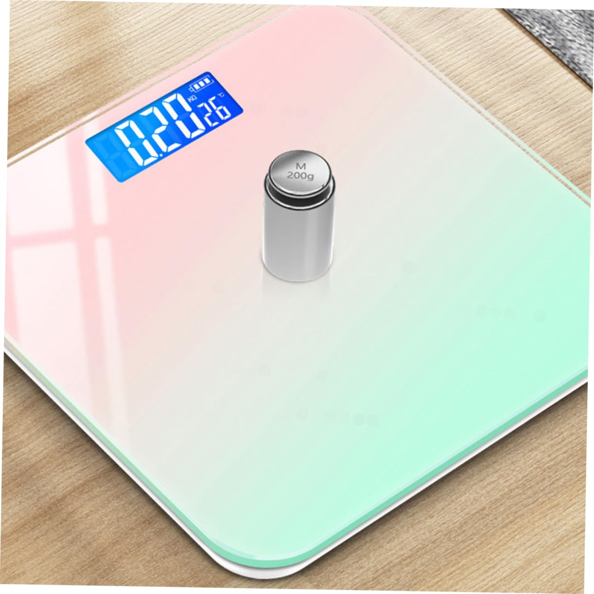 Digitale Badezimmerwaage, Farbverlauf. Anzeige 0,20 kg. Silbernes Gewicht oben.