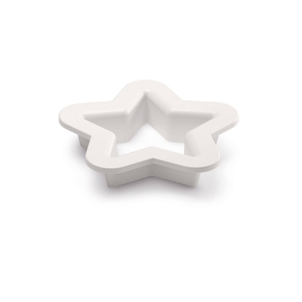 A white, star-shaped cookie cutter on a white surface.