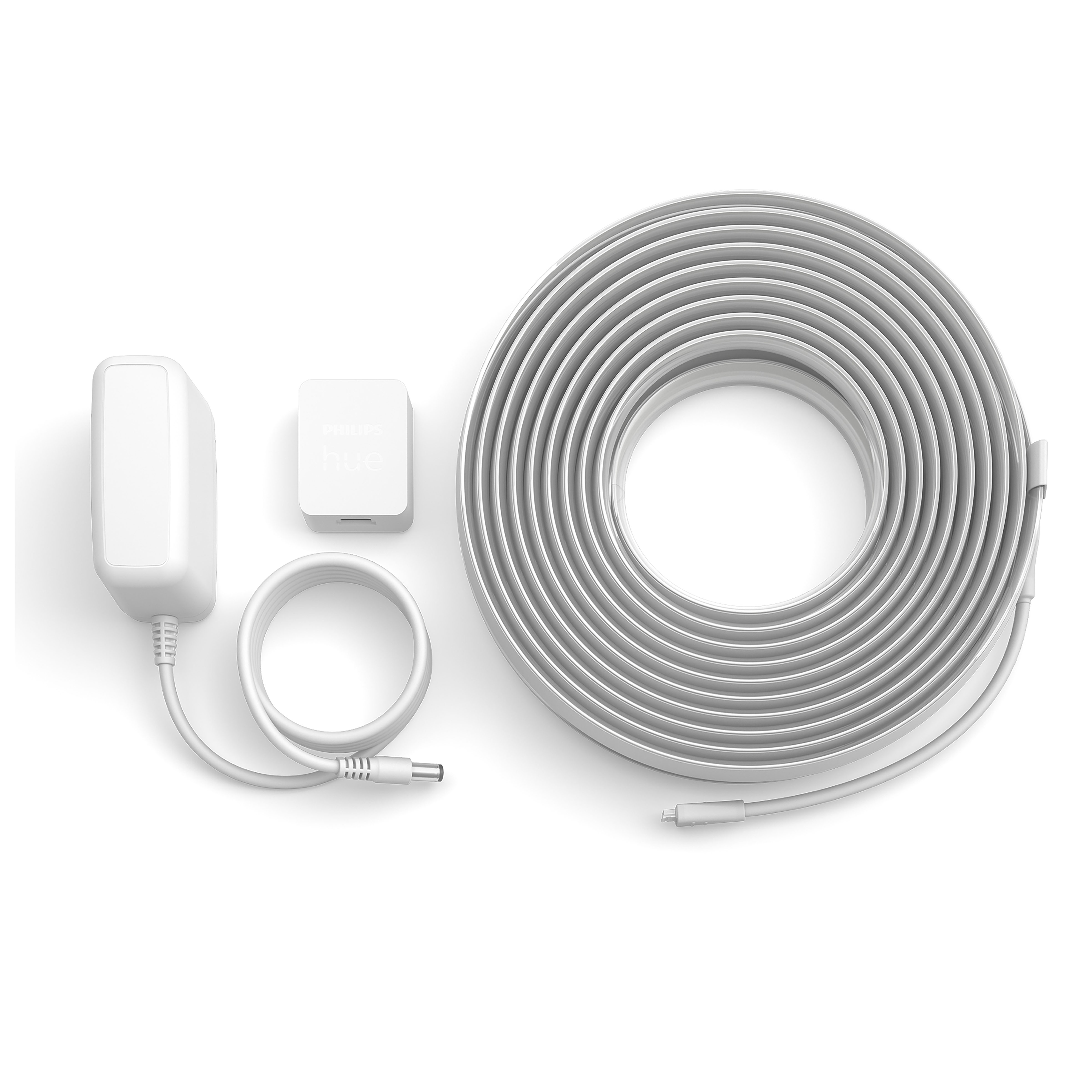 Białe komponenty paska świetlnego Philips Hue: zasilacz, jednostka sterująca i pasek świetlny.