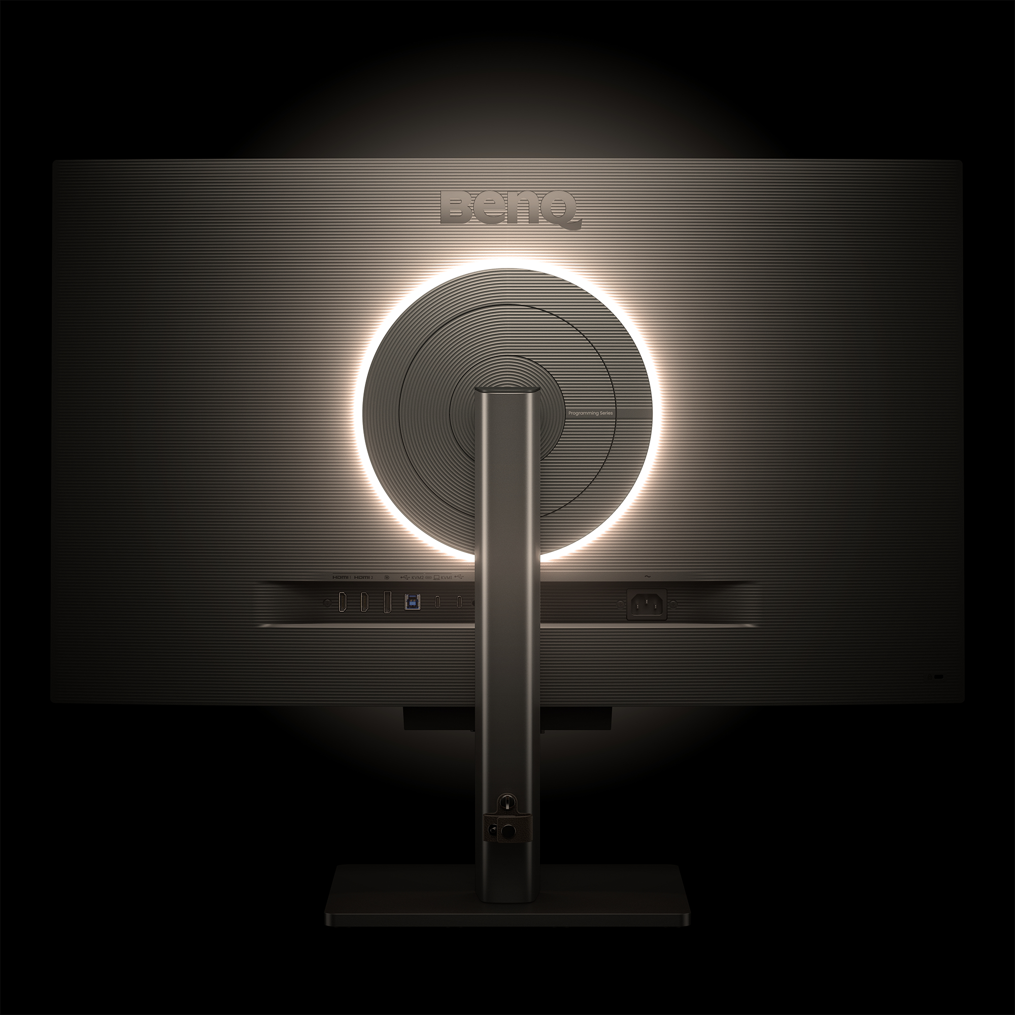 Widok z tyłu czarnego monitora z logo BenQ i okrągłym światłem.