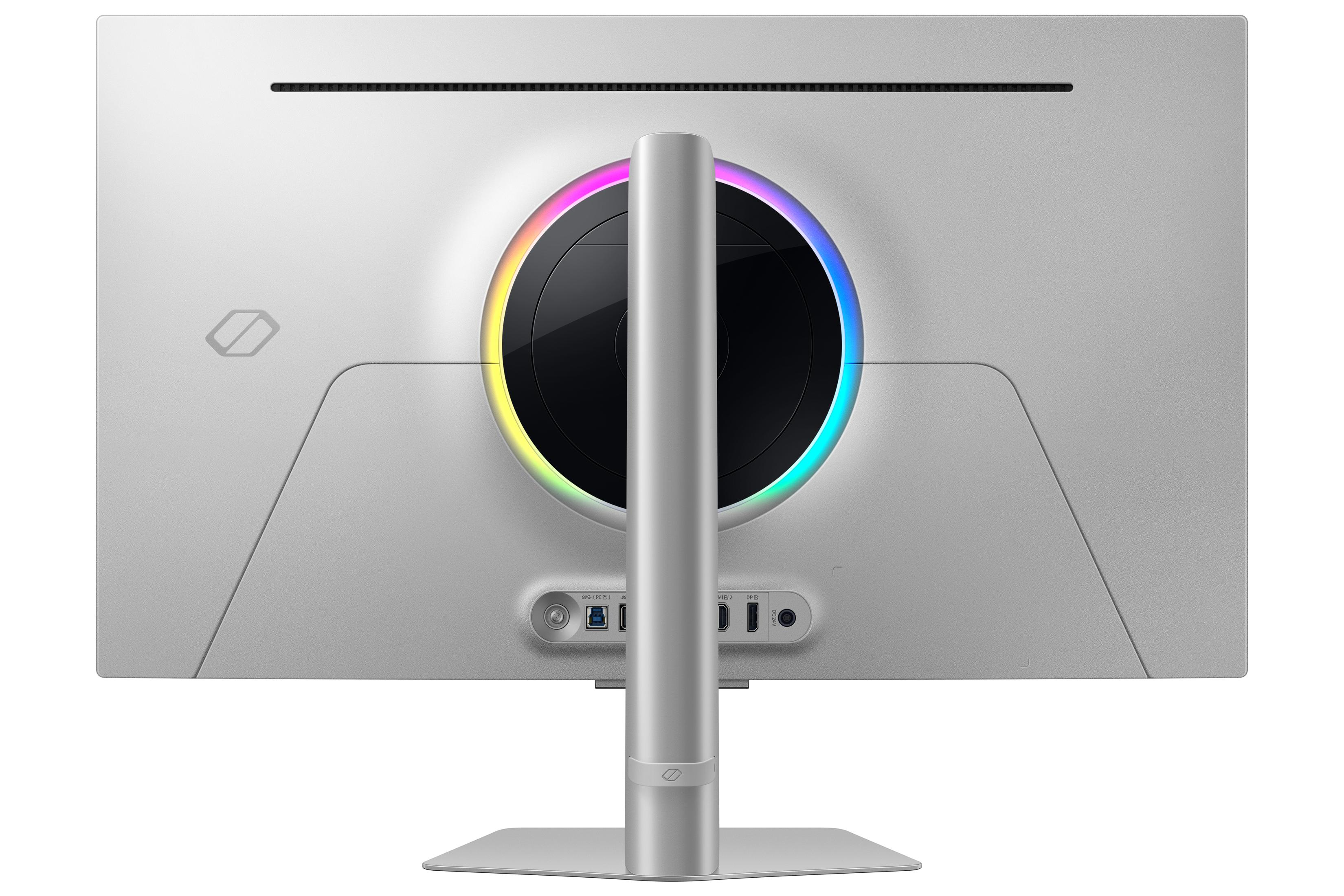 Widok z tyłu srebrnego monitora komputerowego z okrągłym światłem. Widoczne porty.