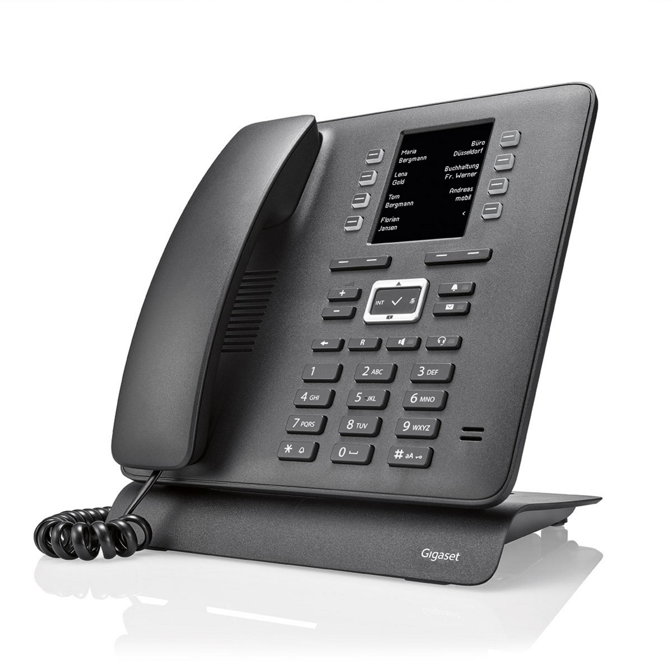 Un telefono Gigaset grigio scuro con display e pulsanti multipli. È su un supporto.