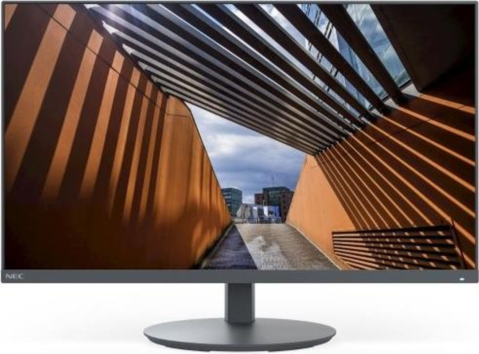 Monitor met een reflectie van een modern gebouw. De monitor is zwart met een zilveren standaard.