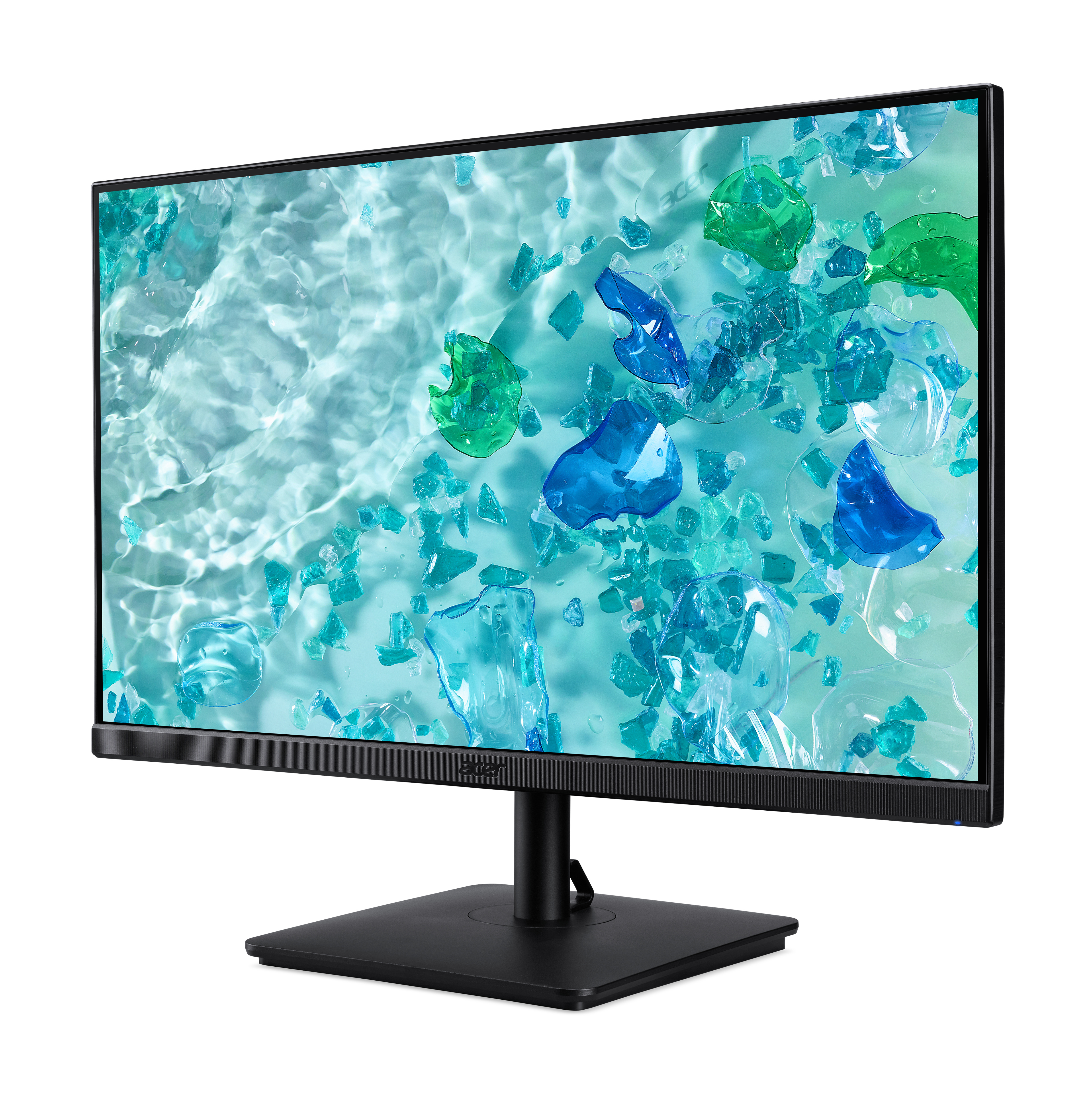 Un monitor mostra una scena acquatica astratta con forme blu e verdi fluttuanti.
