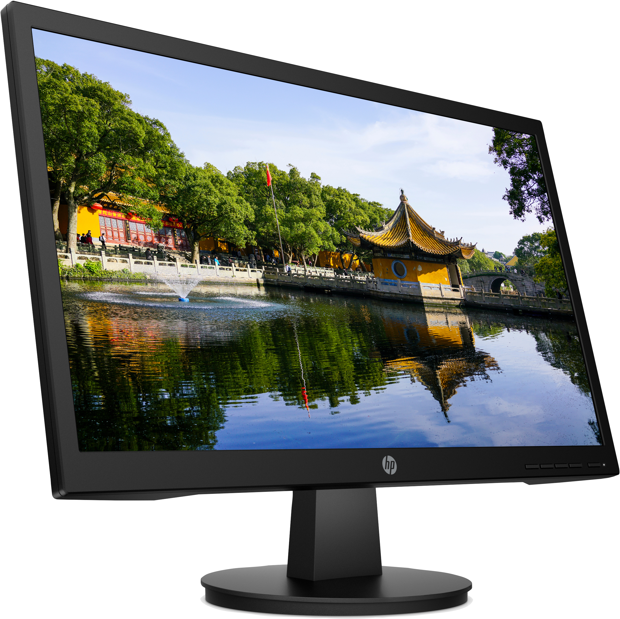 Monitor negro muestra escena con lago, árboles y edificio con techo amarillo.