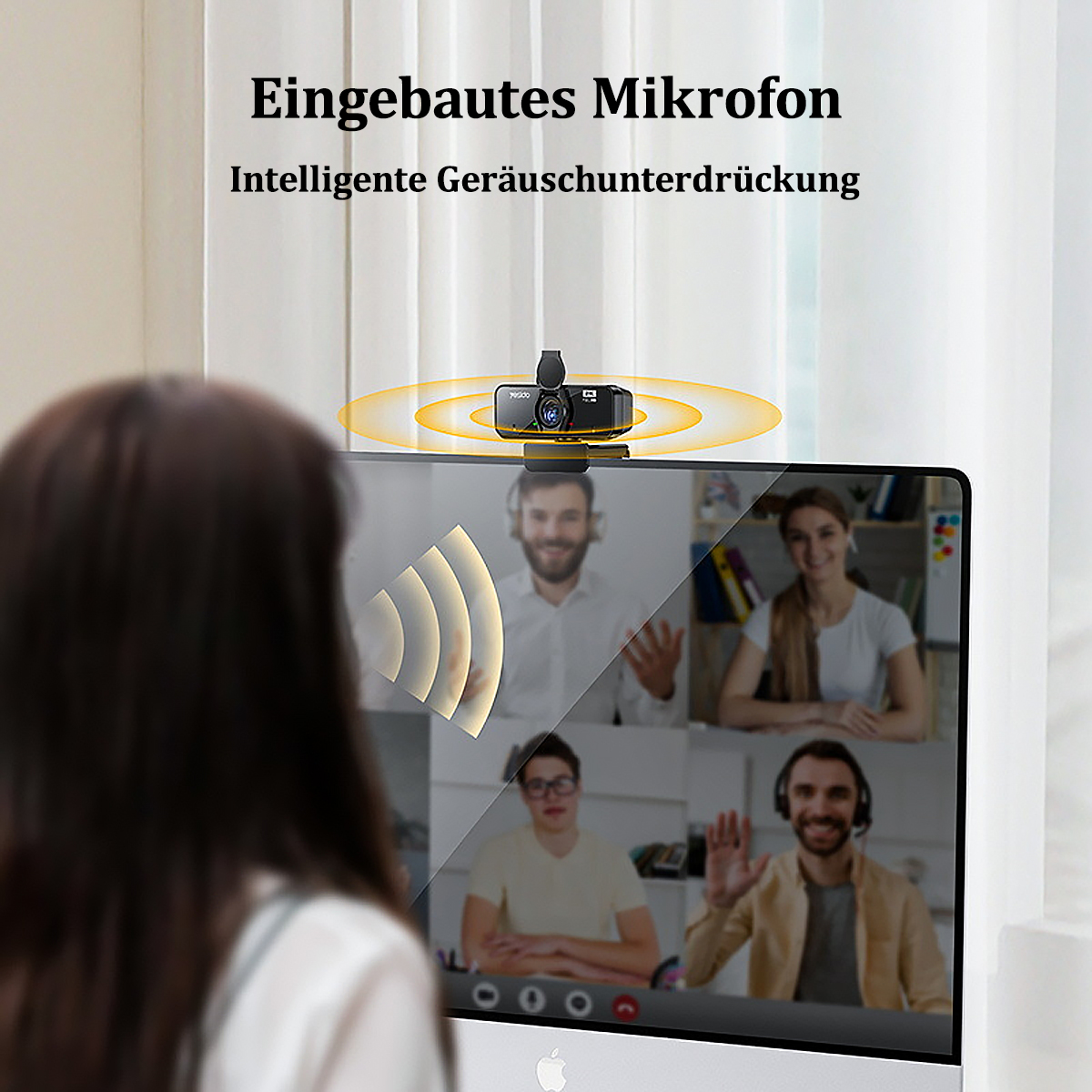 Eine Person blickt auf einen Computerbildschirm mit Webcam. Der Bildschirm zeigt einen Videoanruf mit mehreren Personen.
