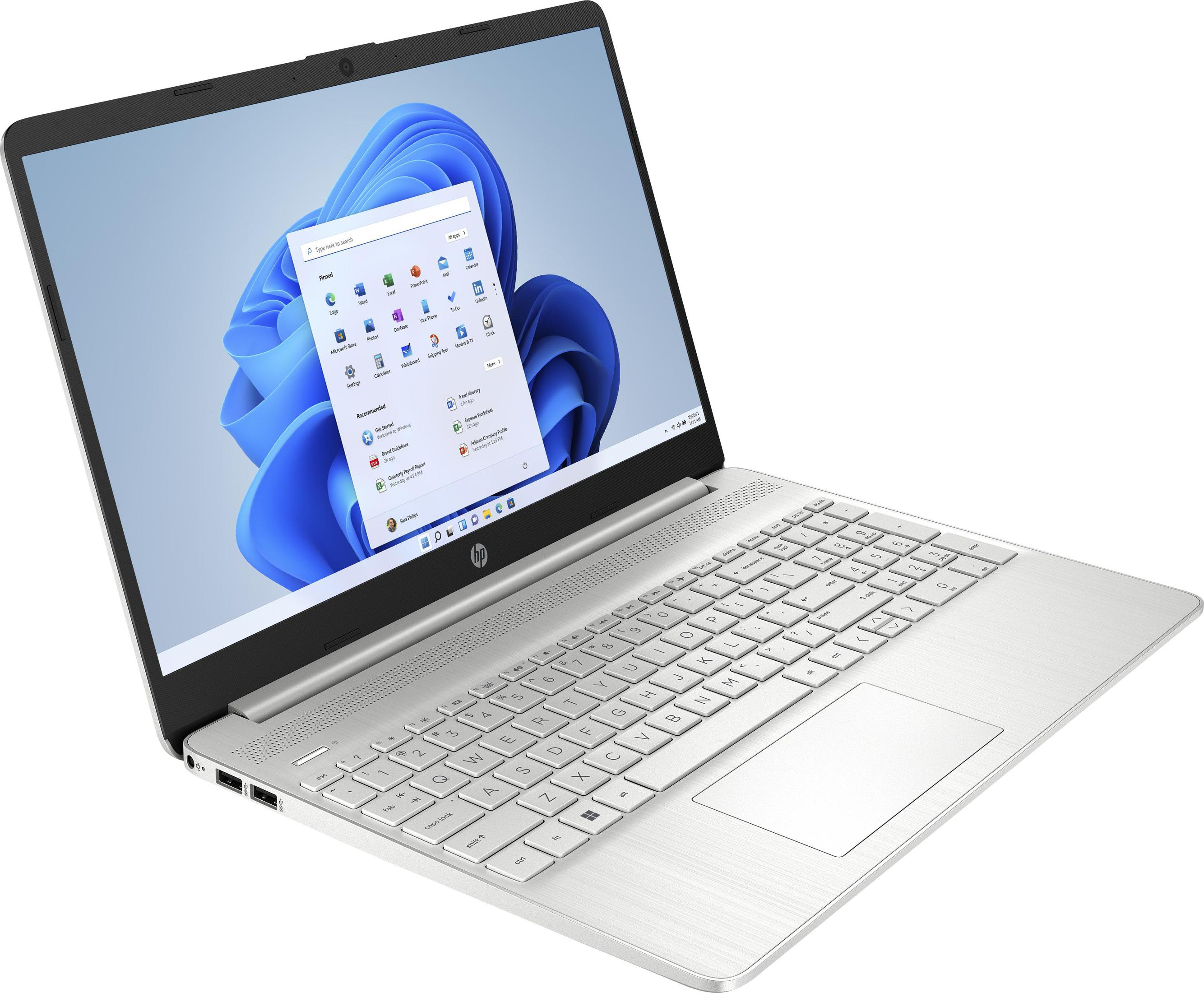 Silberner Laptop mit beleuchtetem Bildschirm, der die Windows 11-Oberfläche zeigt.