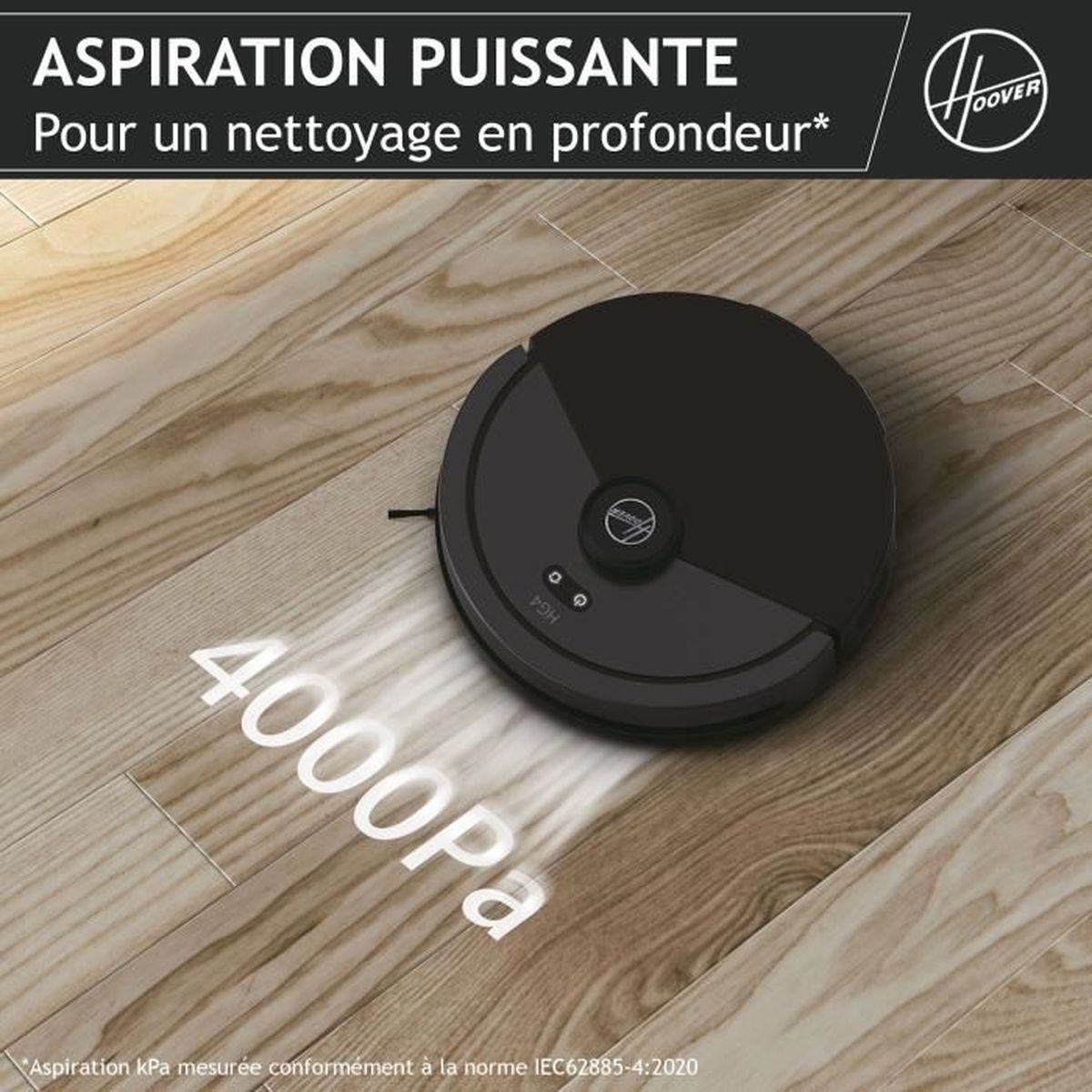 Ein schwarzer Roboter-Staubsauger auf einem Holzboden, mit französischem Text.