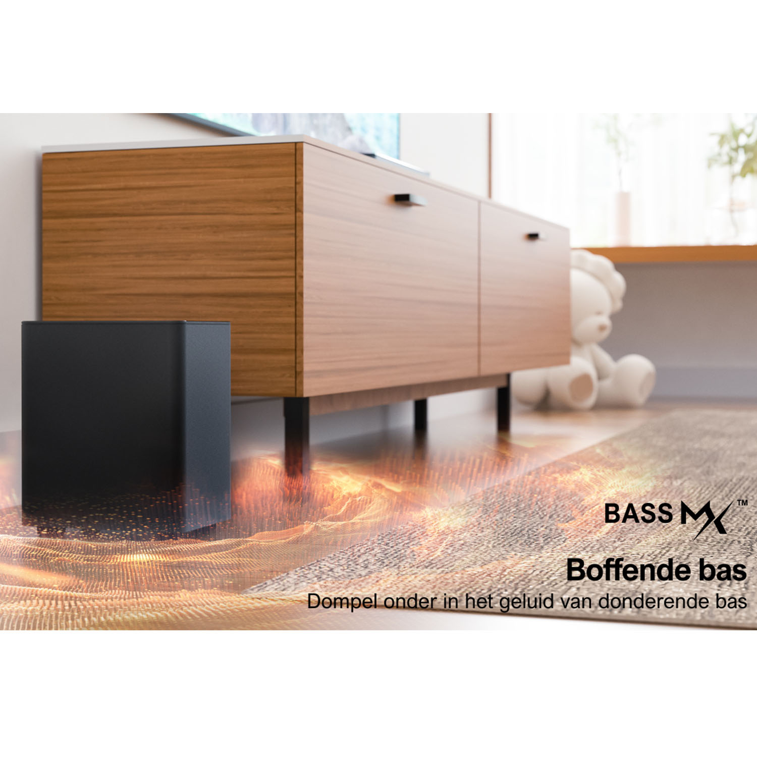 A black subwoofer, a wooden cabinet, and a teddy bear.