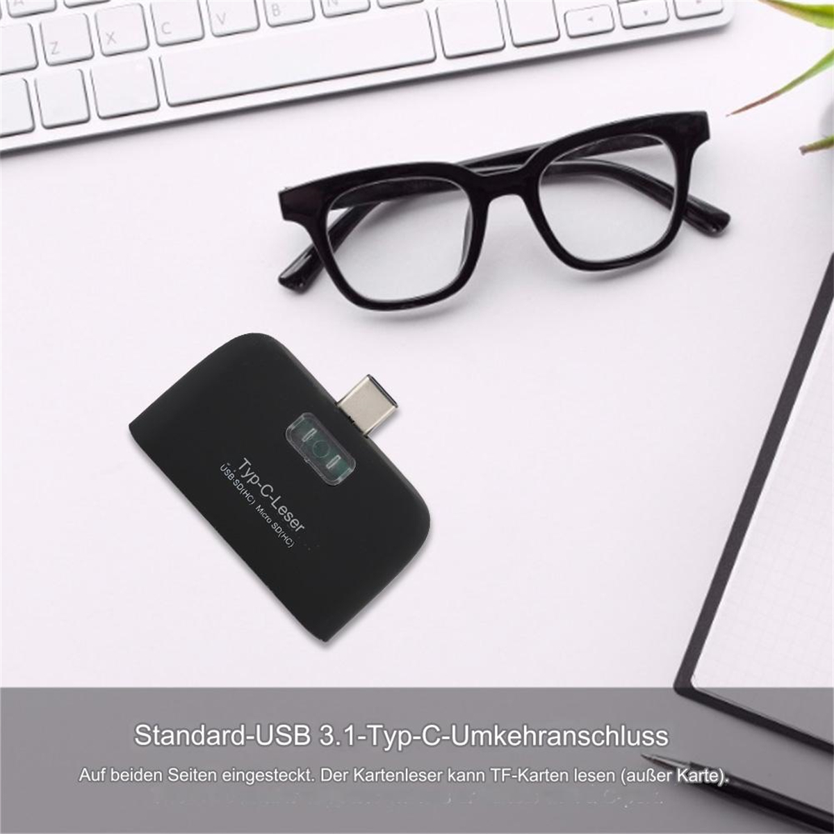 Schwarzer Typ-C-Kartenleser mit Brille und Tastatur im Hintergrund.