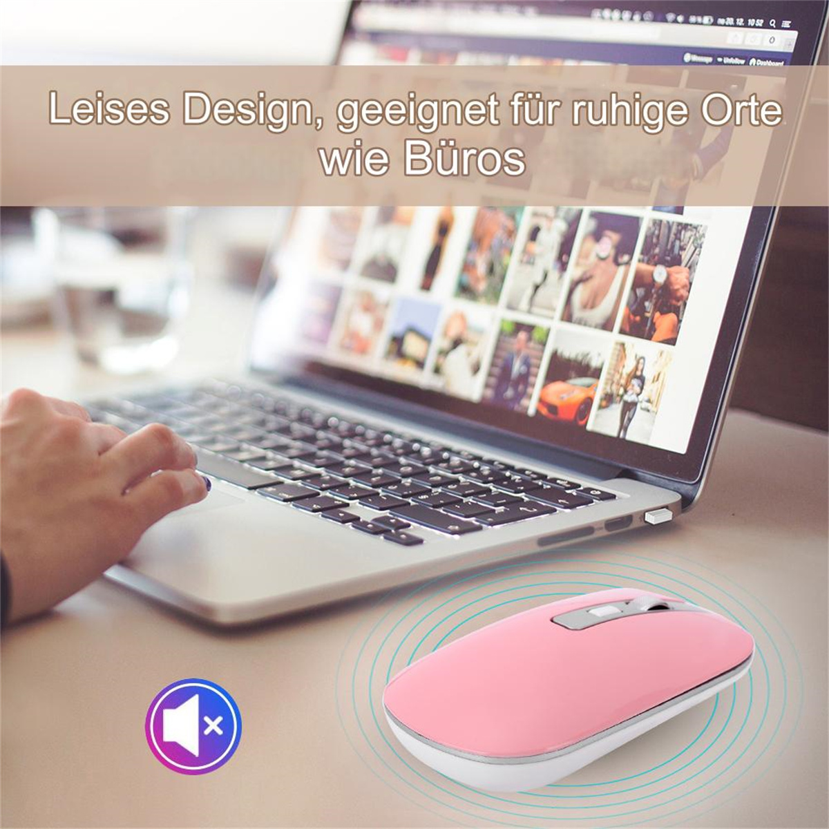 Eine rosa Maus in der Nähe eines Laptops, auf einem Schreibtisch.