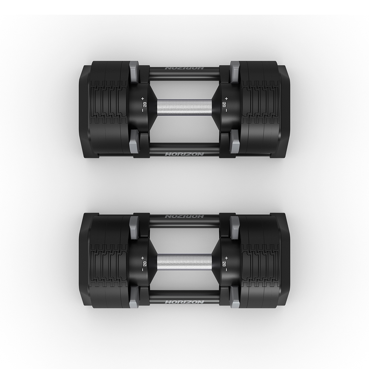Twee zwarte verstelbare dumbbells, bovenaanzicht, met zilveren handvatten en gewichtsinstellingen.