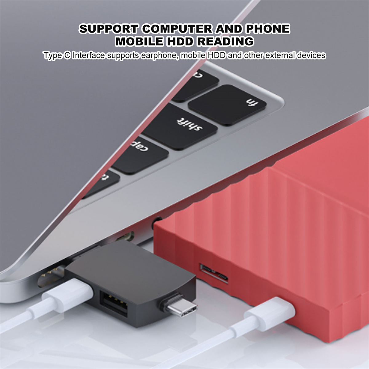 Laptop, verbunden mit USB-Hub, roter Festplatte und weißen Kabeln.