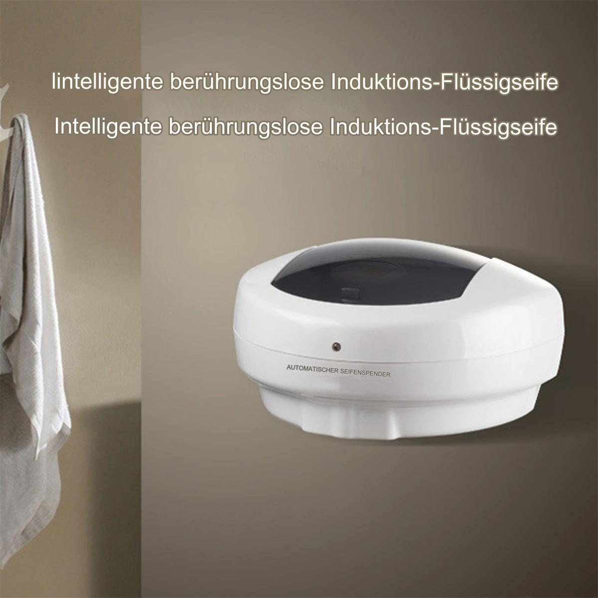 Ein weißer automatischer Seifenspender an der Wand, mit Text unten.