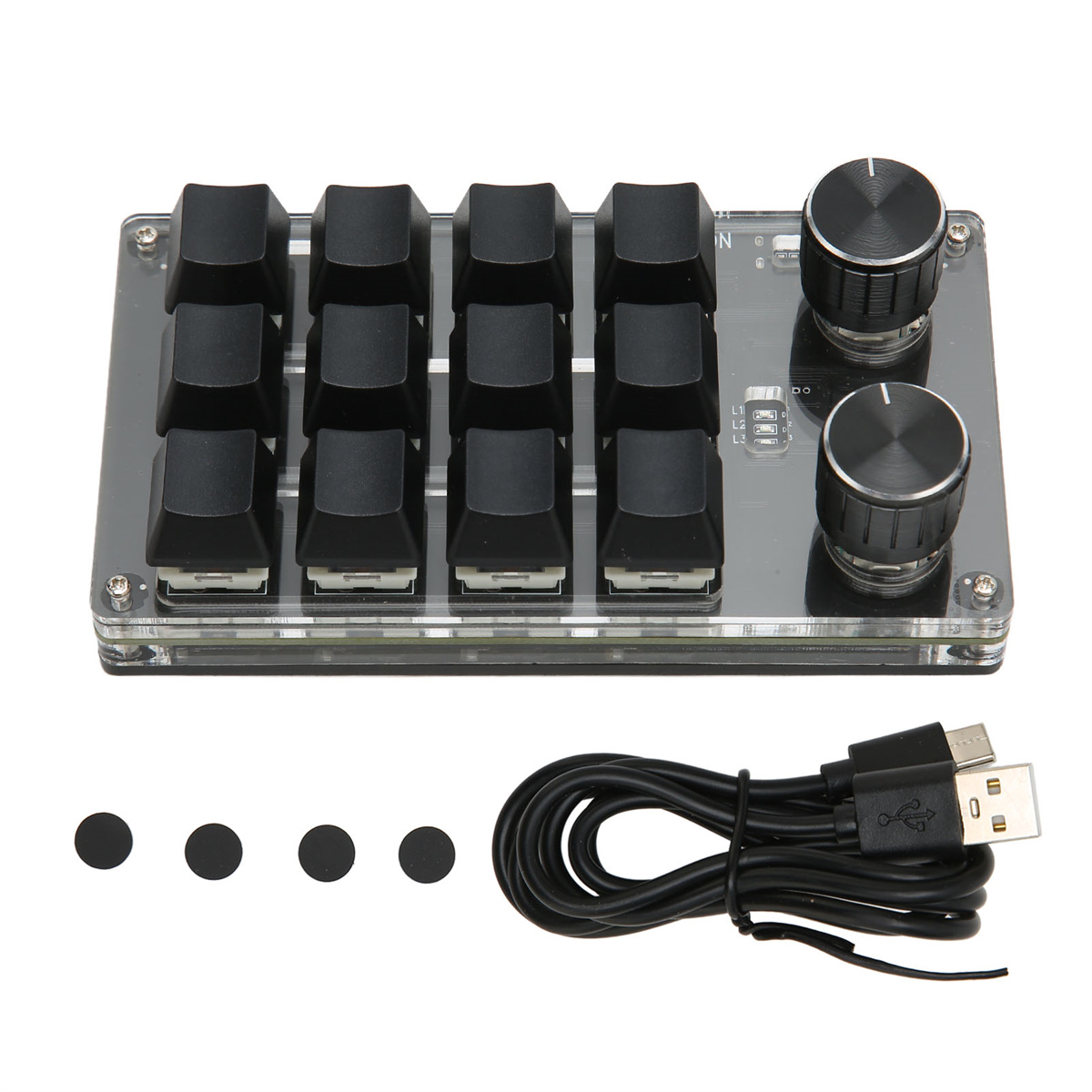 Eine schwarze Tastatur mit 12 Tasten, zwei Knöpfen und einer durchsichtigen Kunststoffbasis. USB-Kabel und Punkte unten.