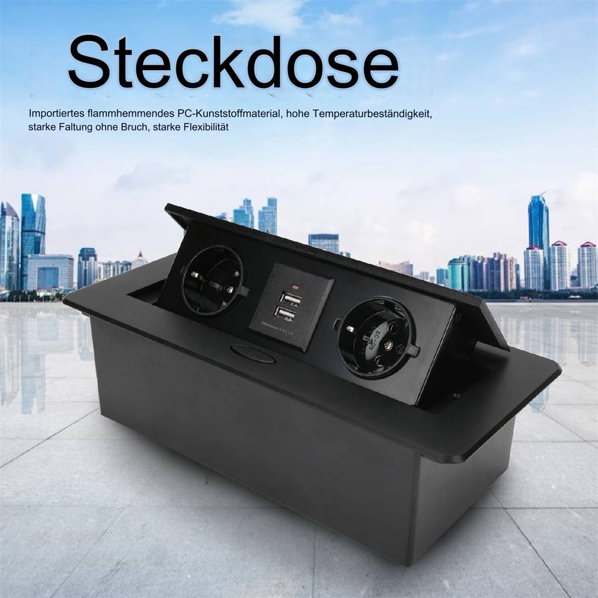 Eine schwarze Pop-up-Steckdose mit USB-Anschlüssen. Oben steht Steckdose.