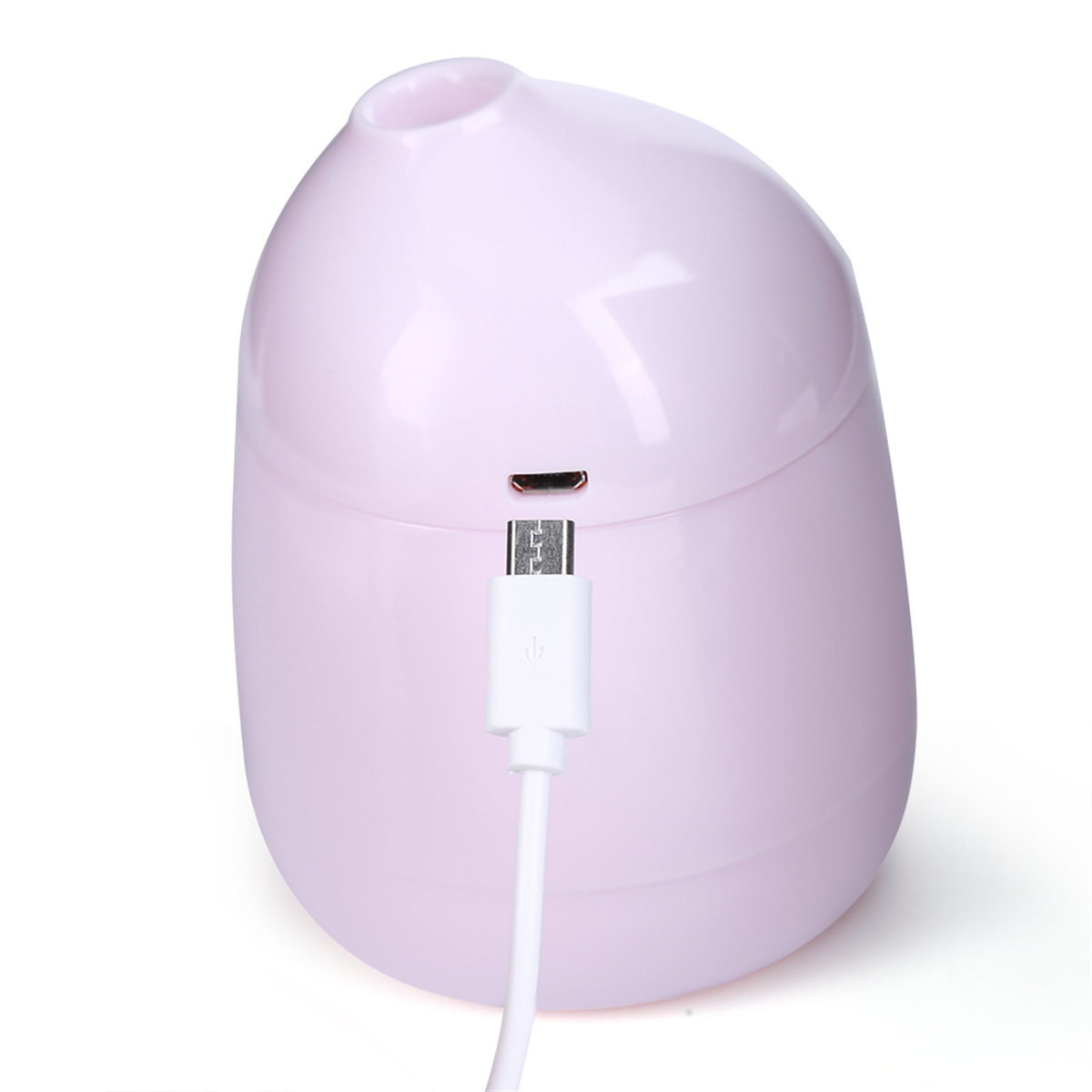 Ein rosa eiförmiges Gerät mit Ladeanschluss und weißem Kabel.