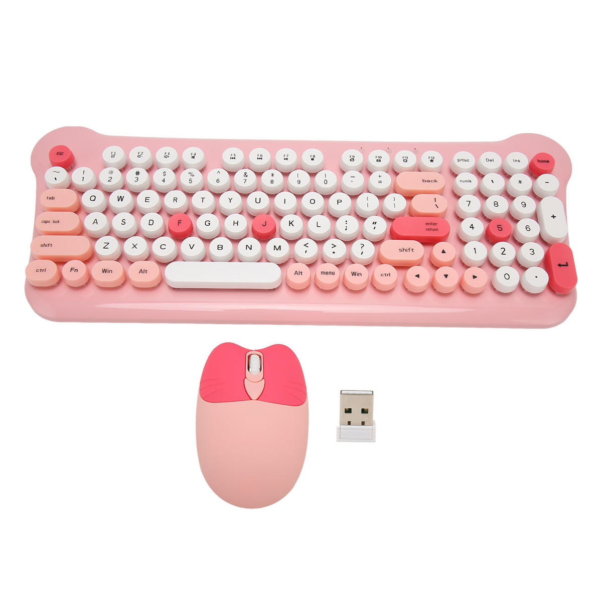 Eine rosa Tastatur mit runden Tasten, eine Maus und ein USB-Empfänger liegen auf einem Schreibtisch.