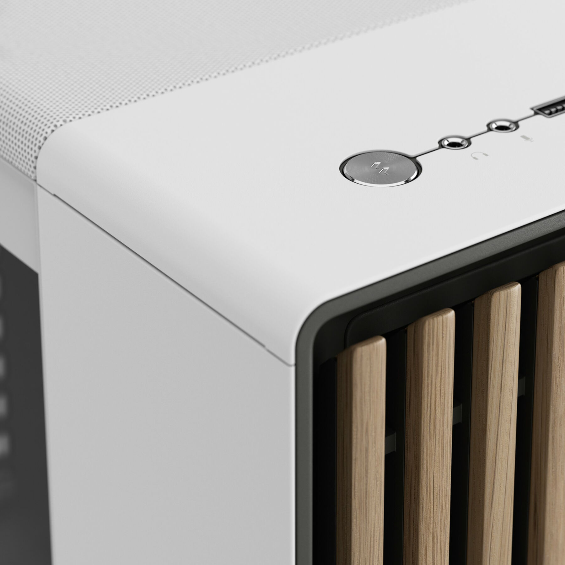 Close-up of white computer case. Power button and wood details.