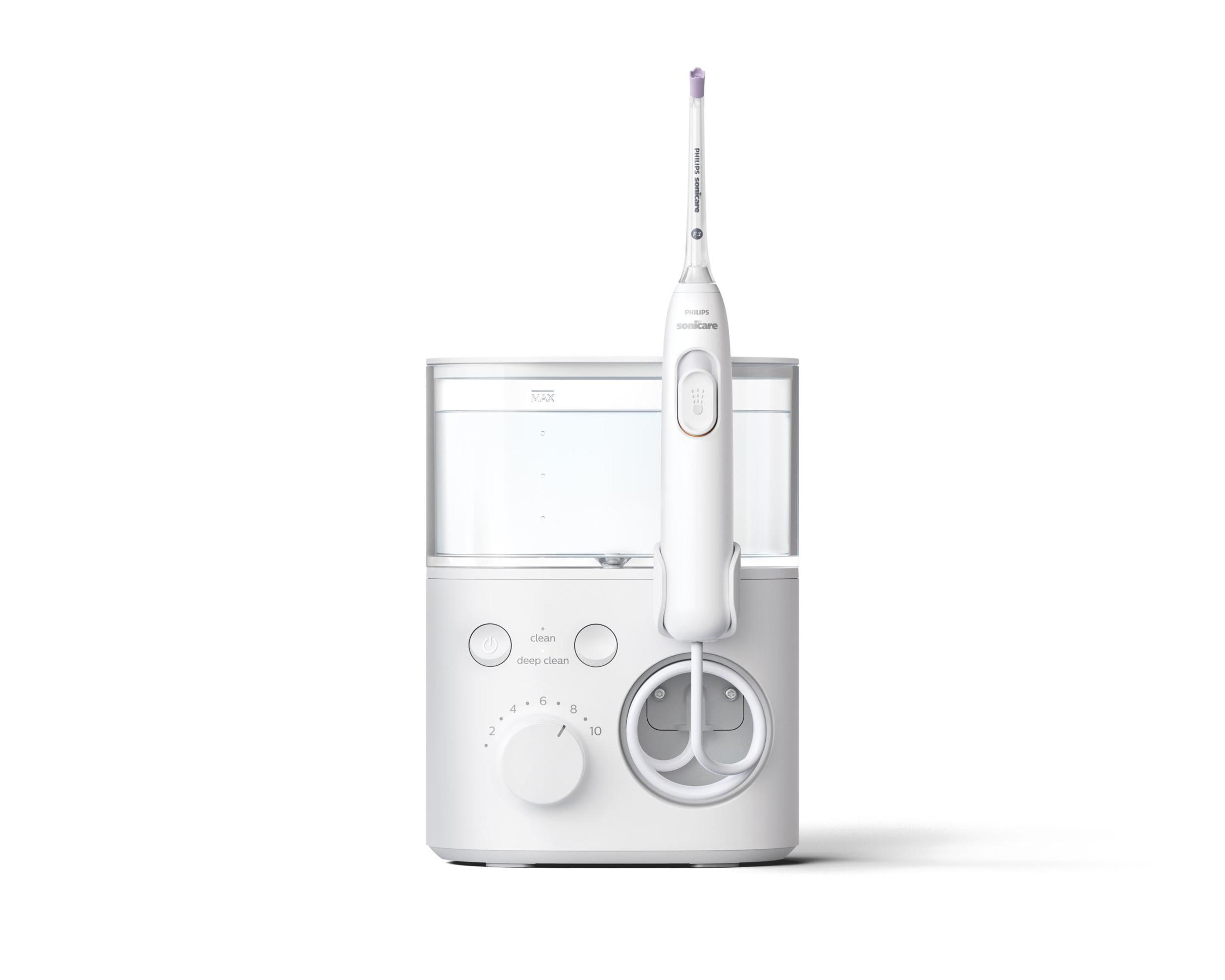 Un idropulsore Philips Sonicare bianco con serbatoio dell'acqua e testina.