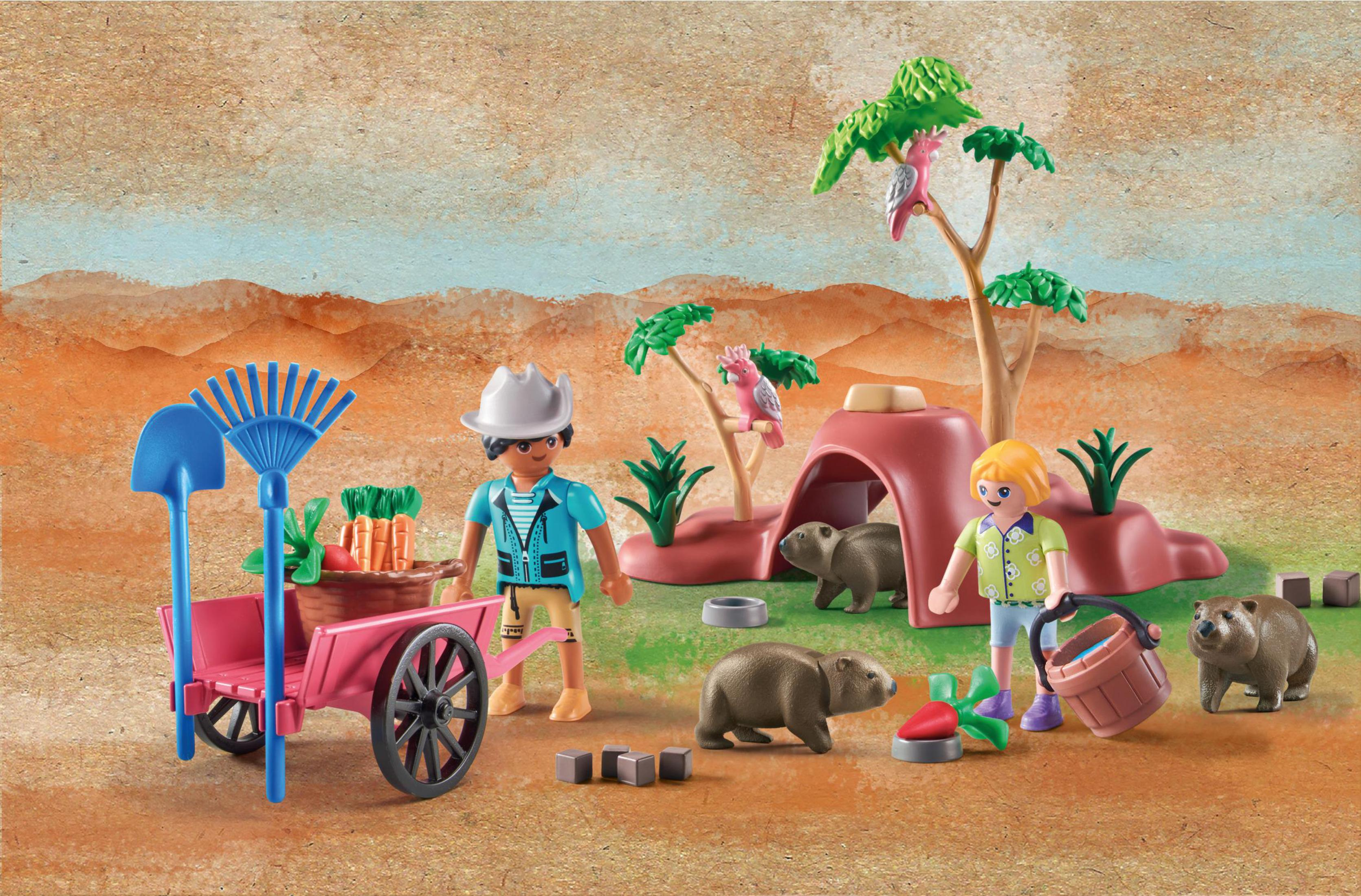 Una scena dello zoo Playmobil con personaggi, animali e accessori. Sfondo desertico.