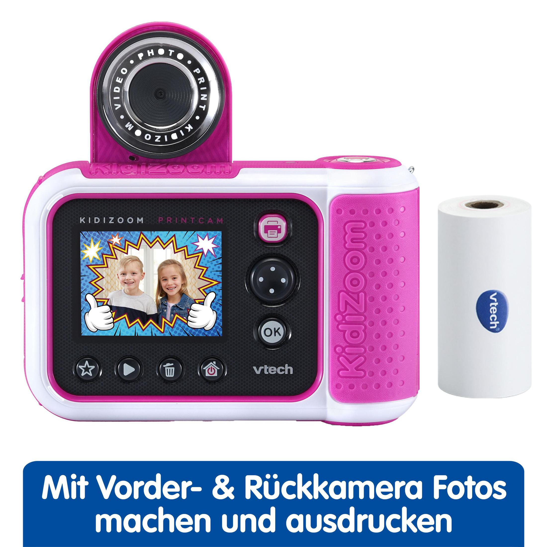 Rosa-weiße Kidizoom-Druckkamera mit Bildschirm, der zwei Kinder zeigt, und einer Rolle weißem Papier.