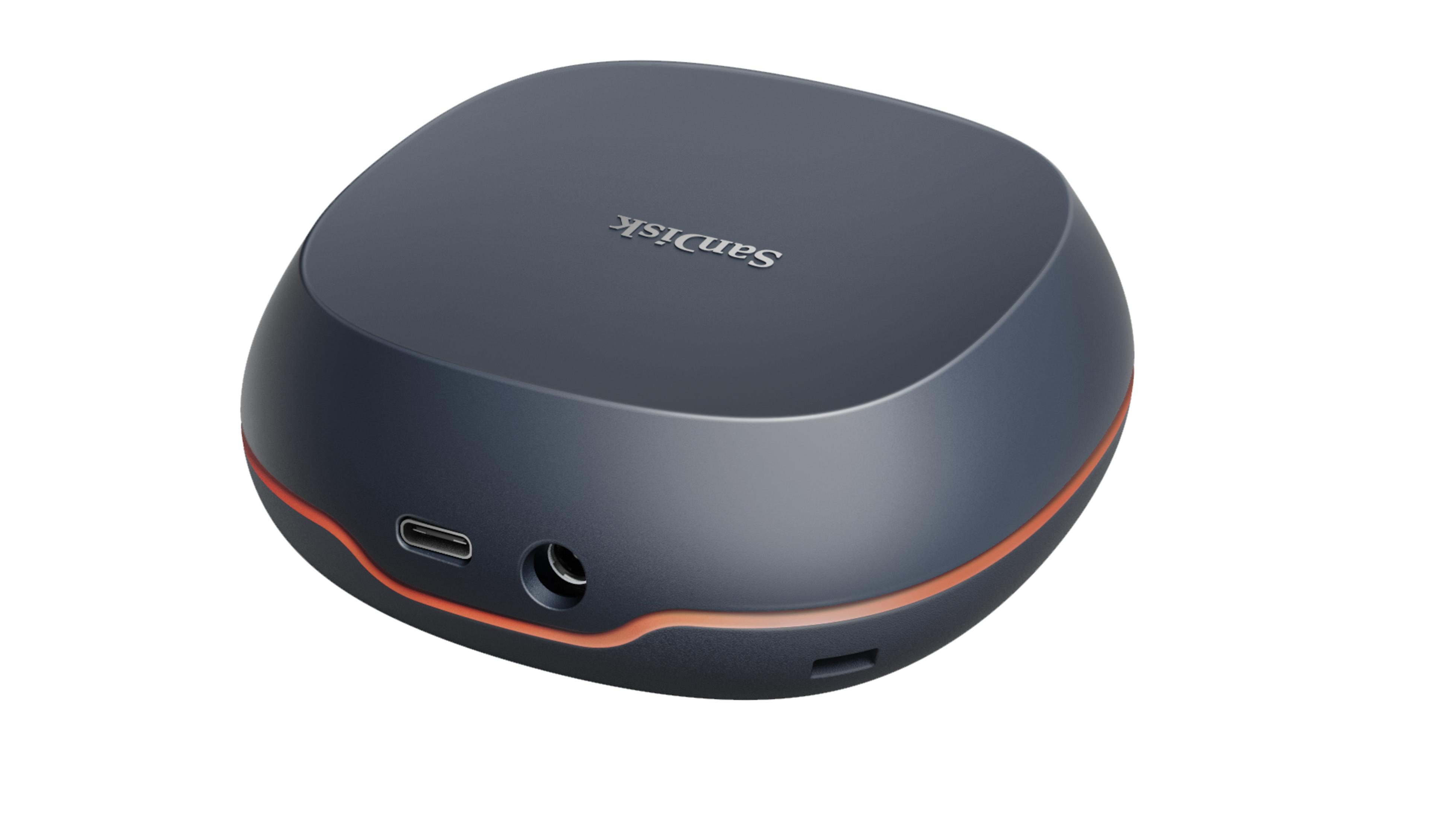 Ciemnoszare urządzenie SanDisk z pomarańczowymi akcentami, portem USB-C i gniazdem słuchawkowym.