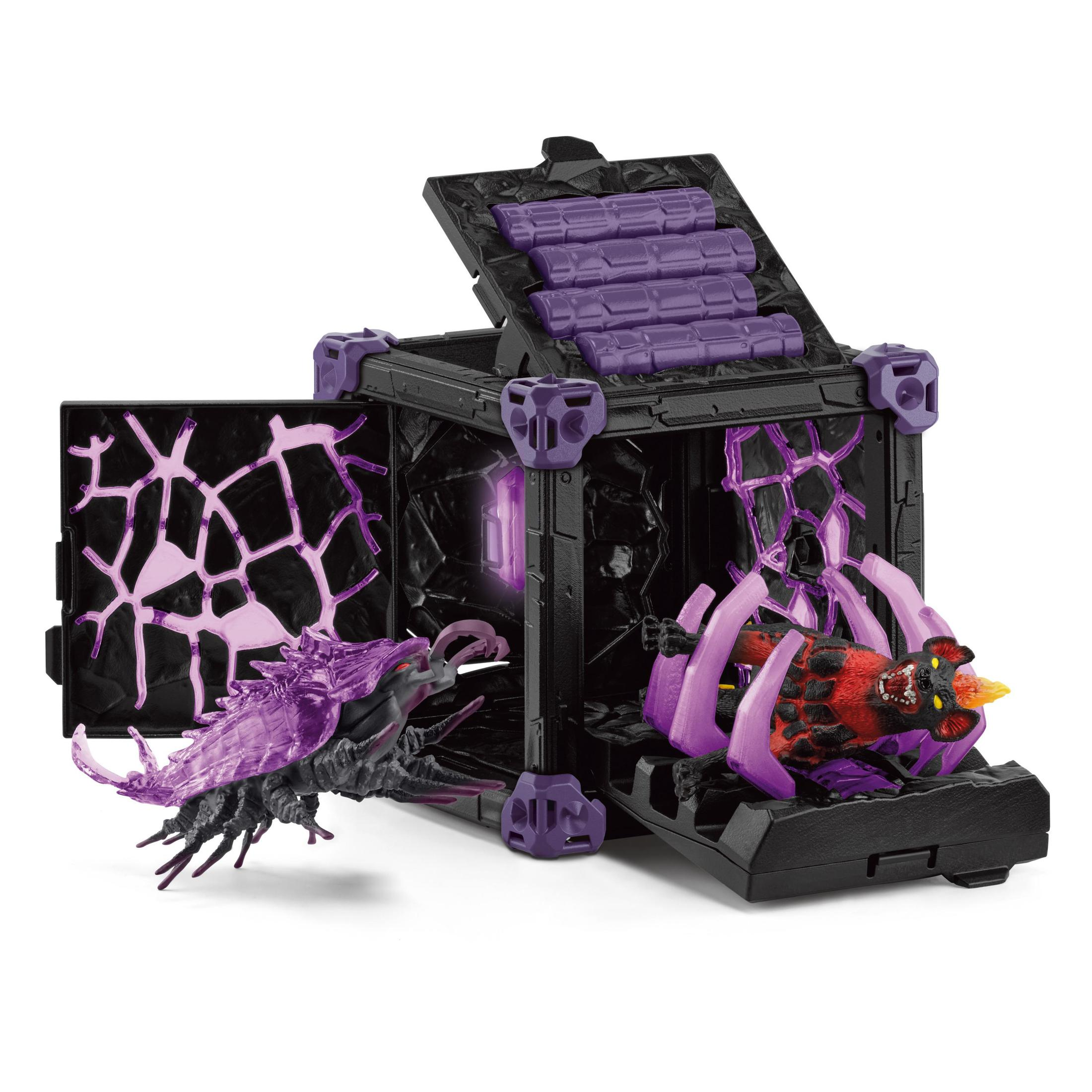 Eine Spielzeugkiste mit zwei Monsterfiguren darin. Die Kiste ist schwarz und lila. Weißer Hintergrund.