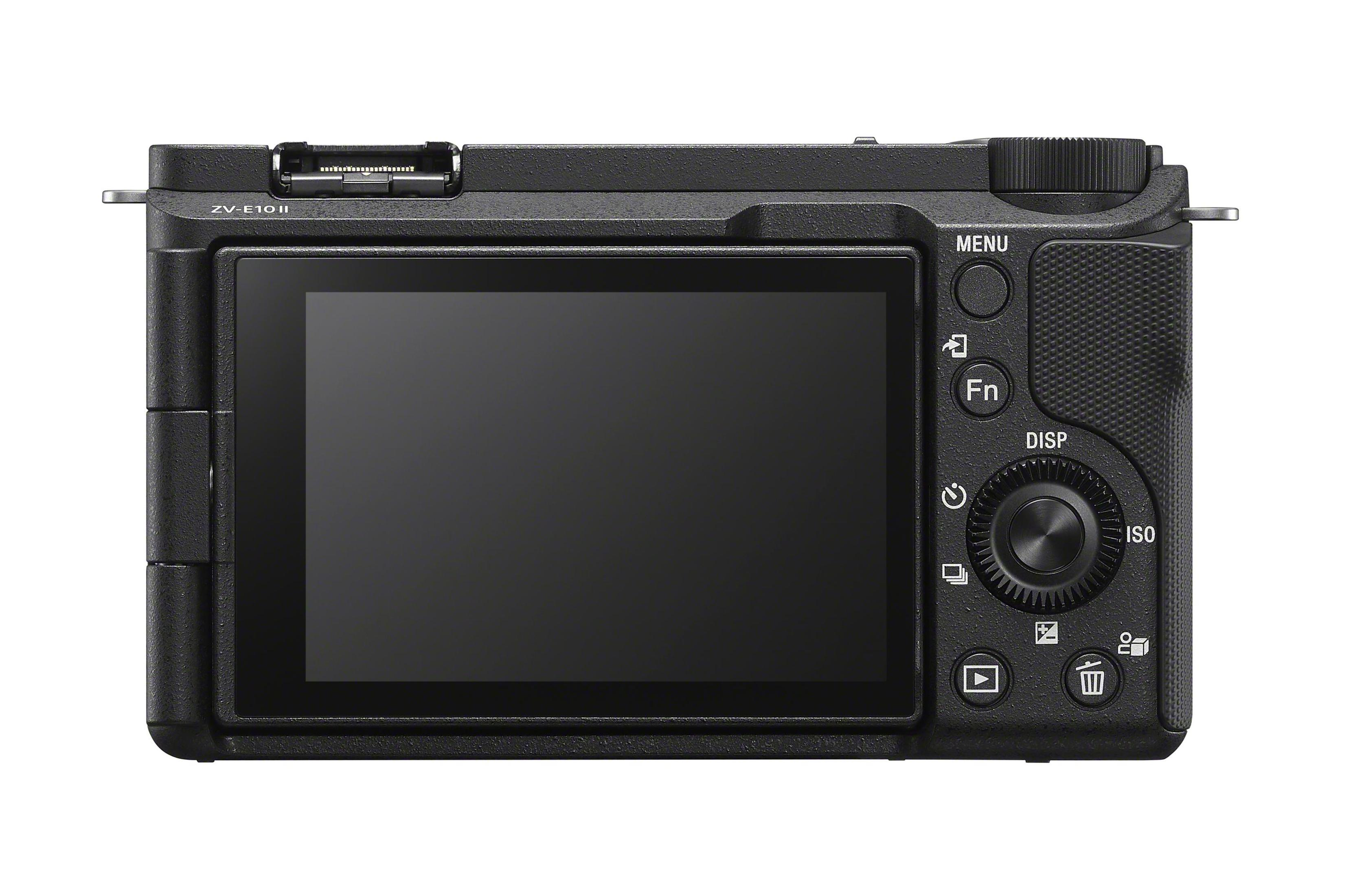 Retro fotocamera nera con schermo, pulsanti e ghiera. Testo ZV-E10 II visibile.