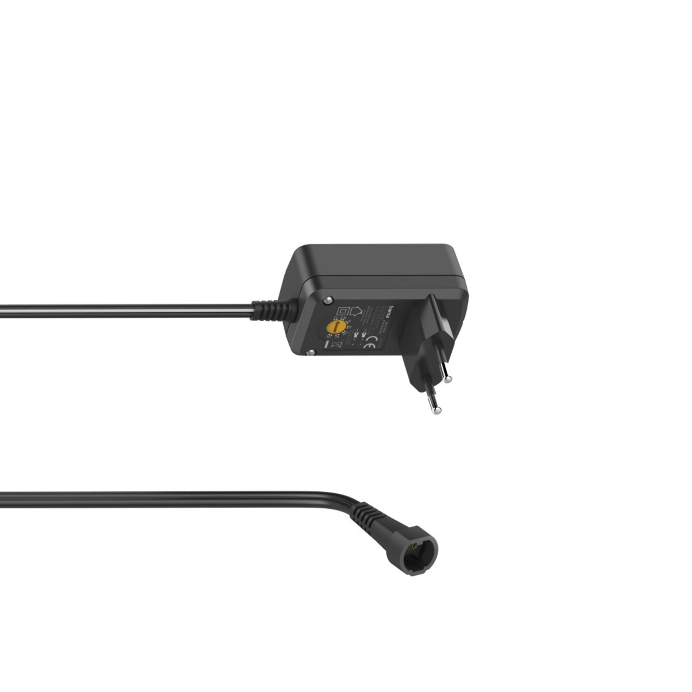 Schwarzes Netzteil mit schwarzem Kabel und Stecker. Der Adapter hat einen Drehregler.
