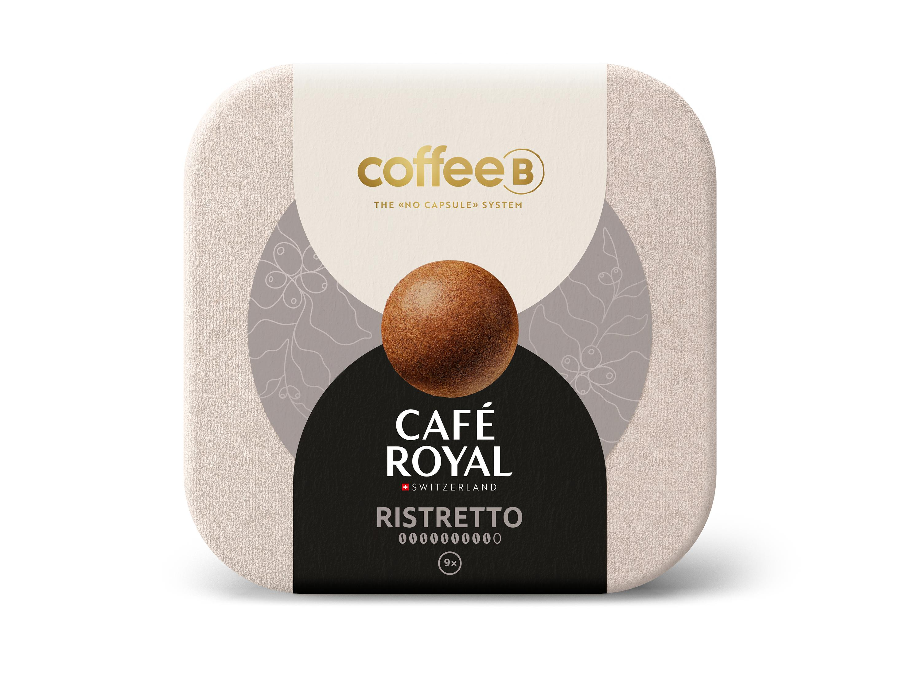 Eine quadratische Kaffeepad-Box mit der Aufschrift 'Café Royal Ristretto' und einer Kaffeebohne auf weißem und beigem Hintergrund.