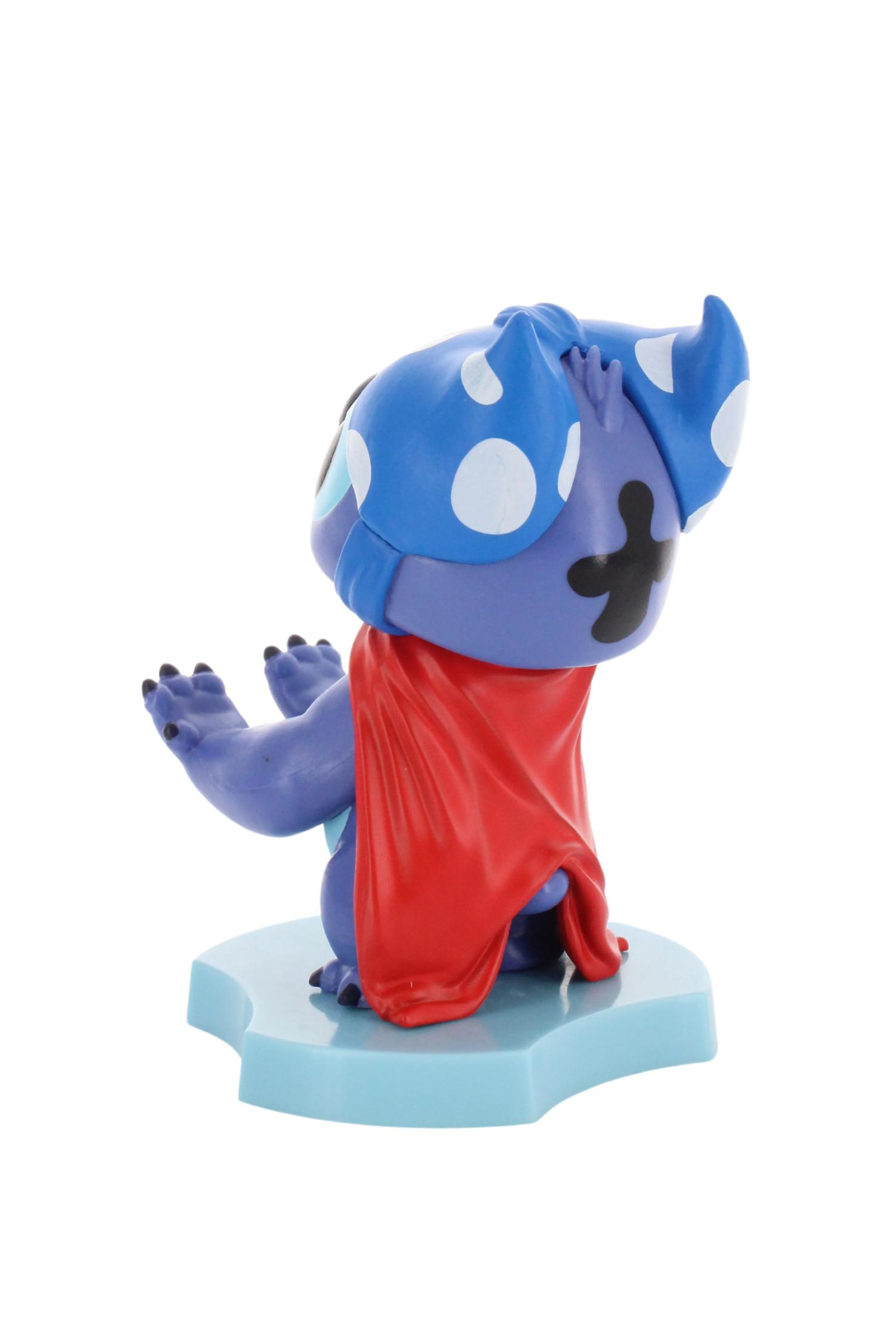 Statuetta di Stitch in costume blu a pois bianchi e mantello rosso. Di spalle.