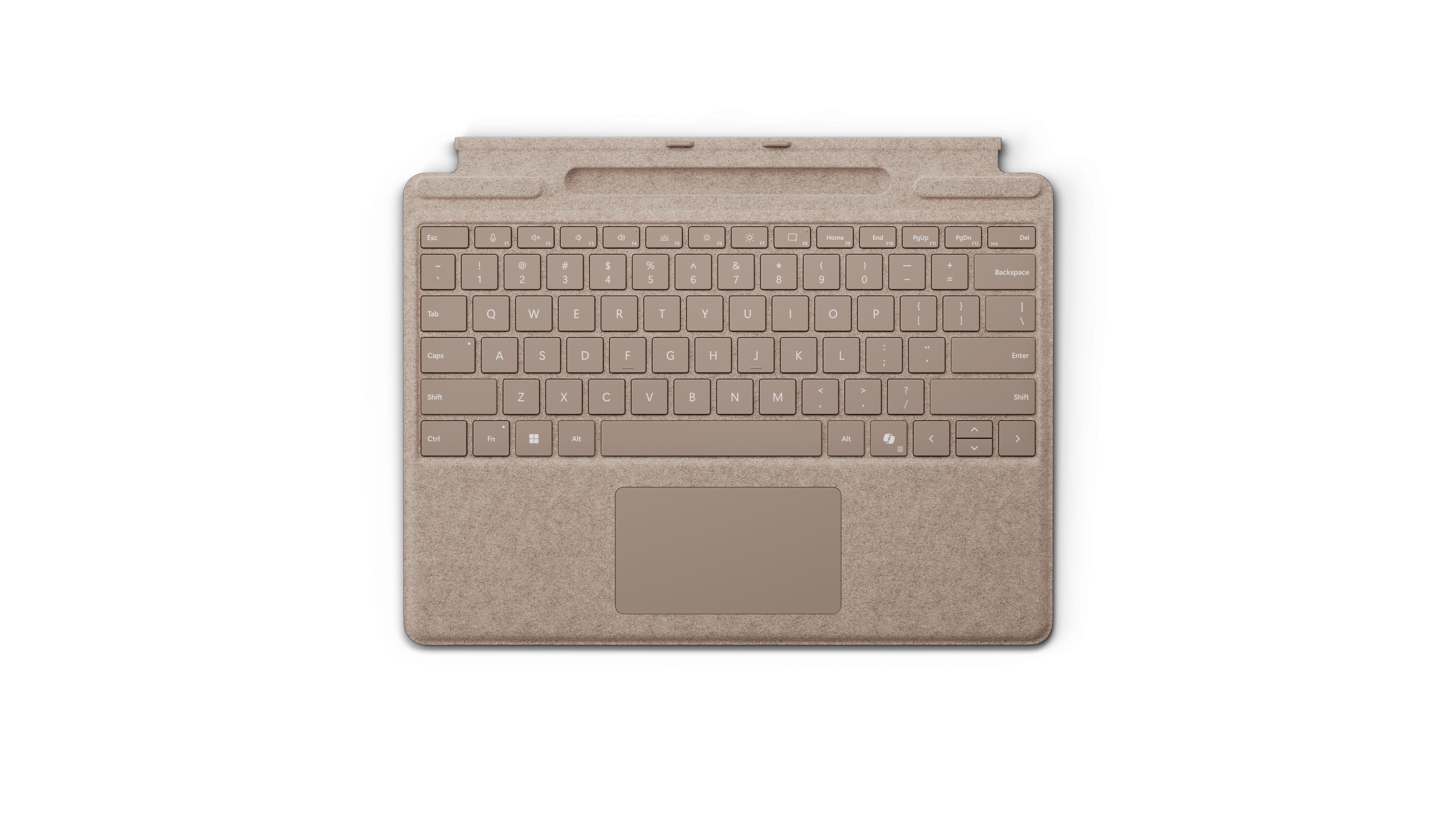 Vista dall'alto di una cover per tastiera beige, tasti e touchpad su una superficie bianca.