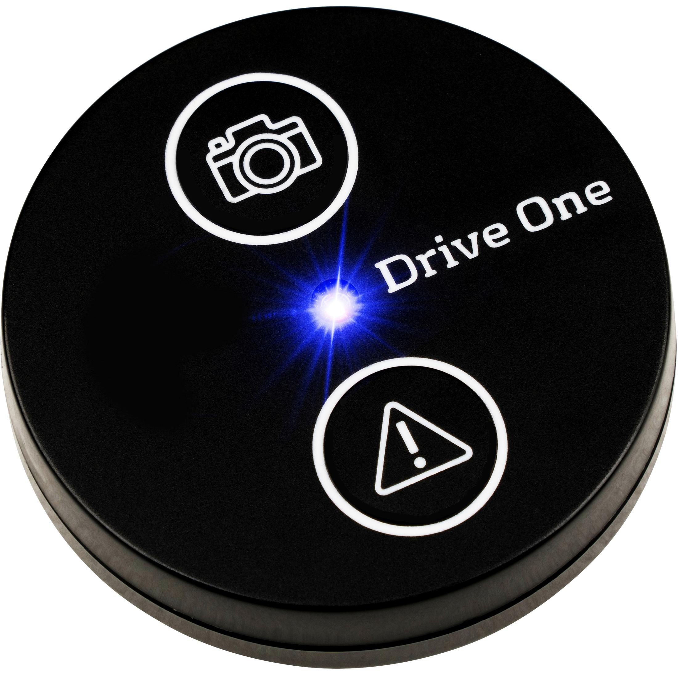 Schwarzer runder Knopf mit Kamera- und Alarm-Symbolen, Text 'Drive One'.