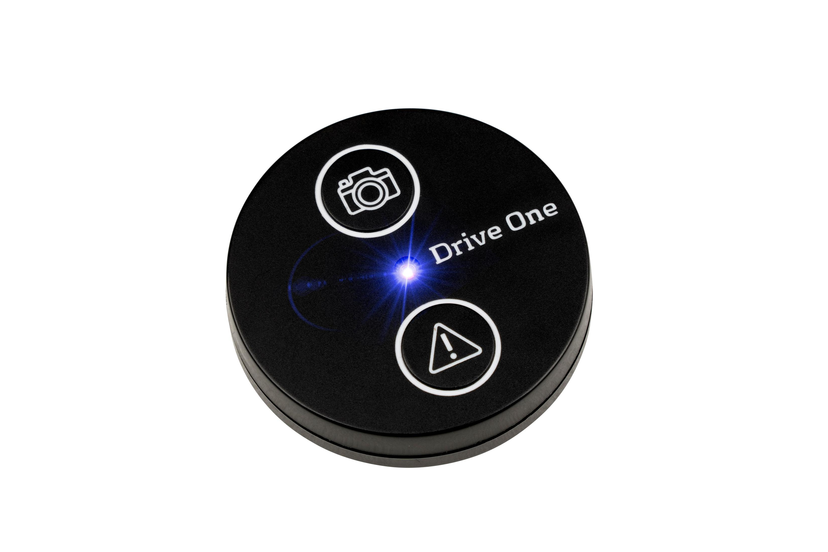 Schwarzer runder Knopf mit Kamera- und Alarm-Symbolen, Text 'Drive One'.