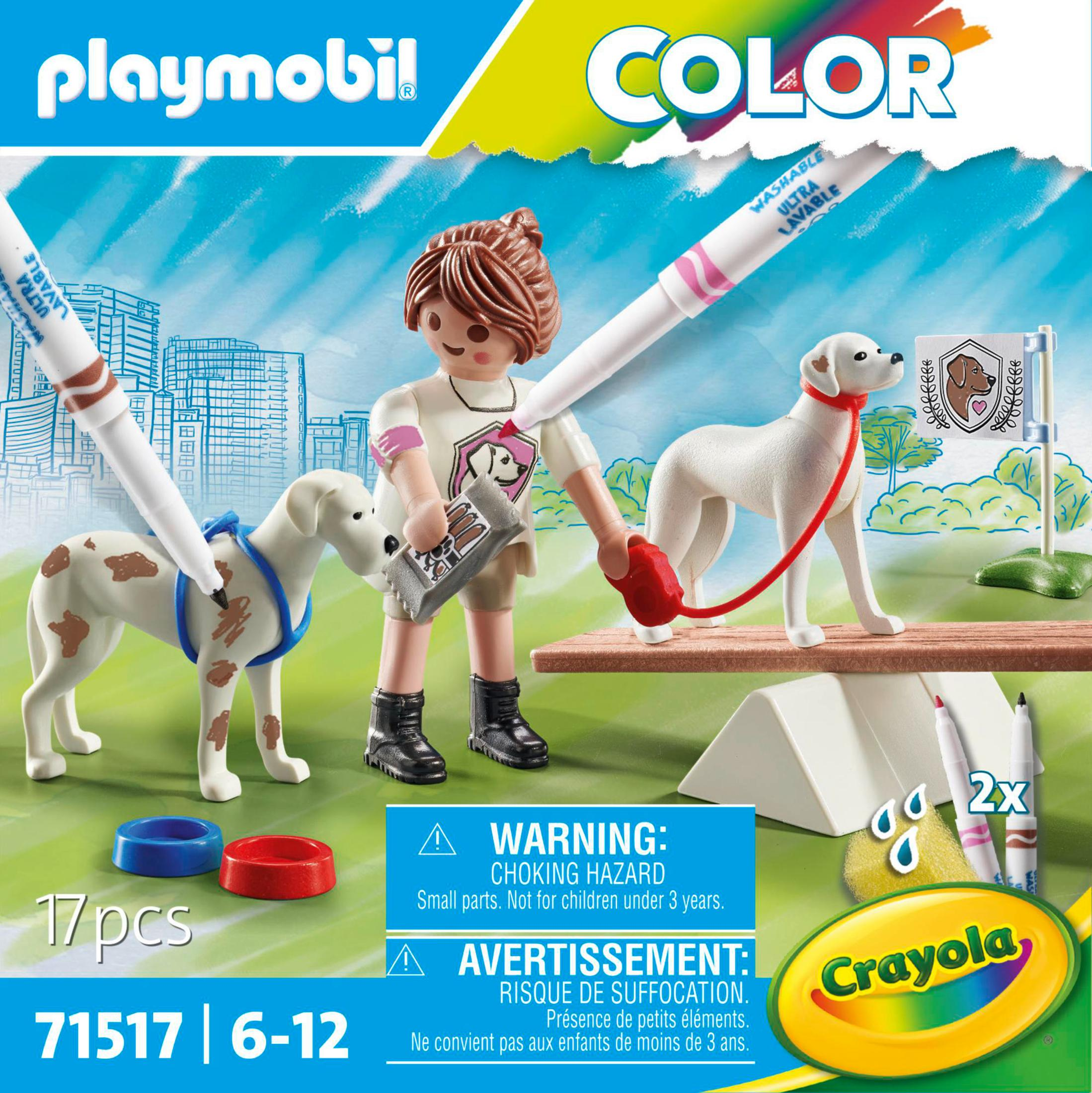 Set Playmobil con niña, perros, bolígrafos y texto de advertencia sobre peligro de asfixia.