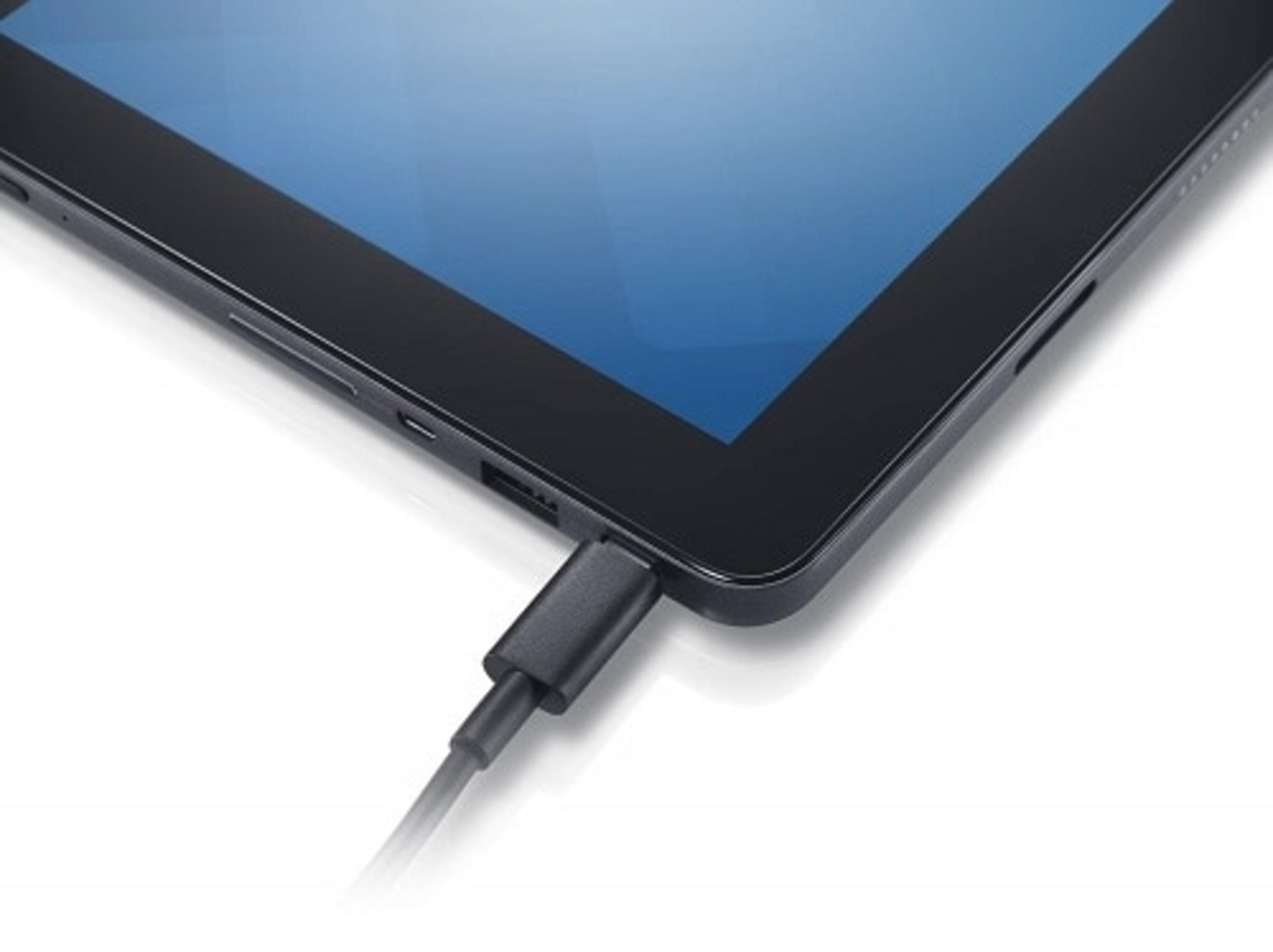 Tablet wird geladen. Schwarzes Tablet mit angeschlossenem Ladekabel.