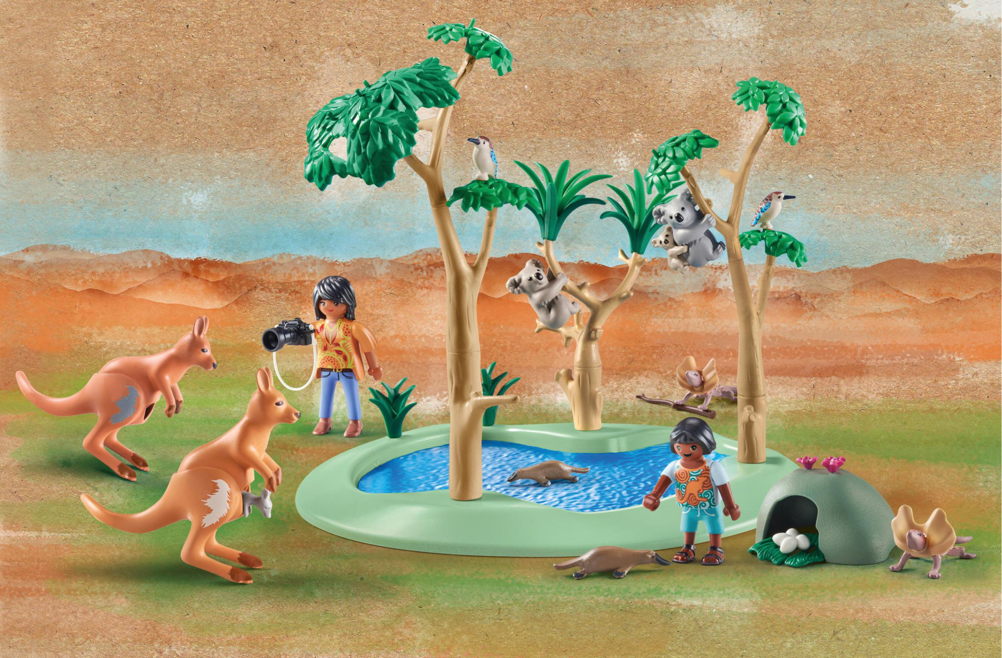 Scena Playmobil con canguri, koala, uccelli e persone. Una piscina è al centro.