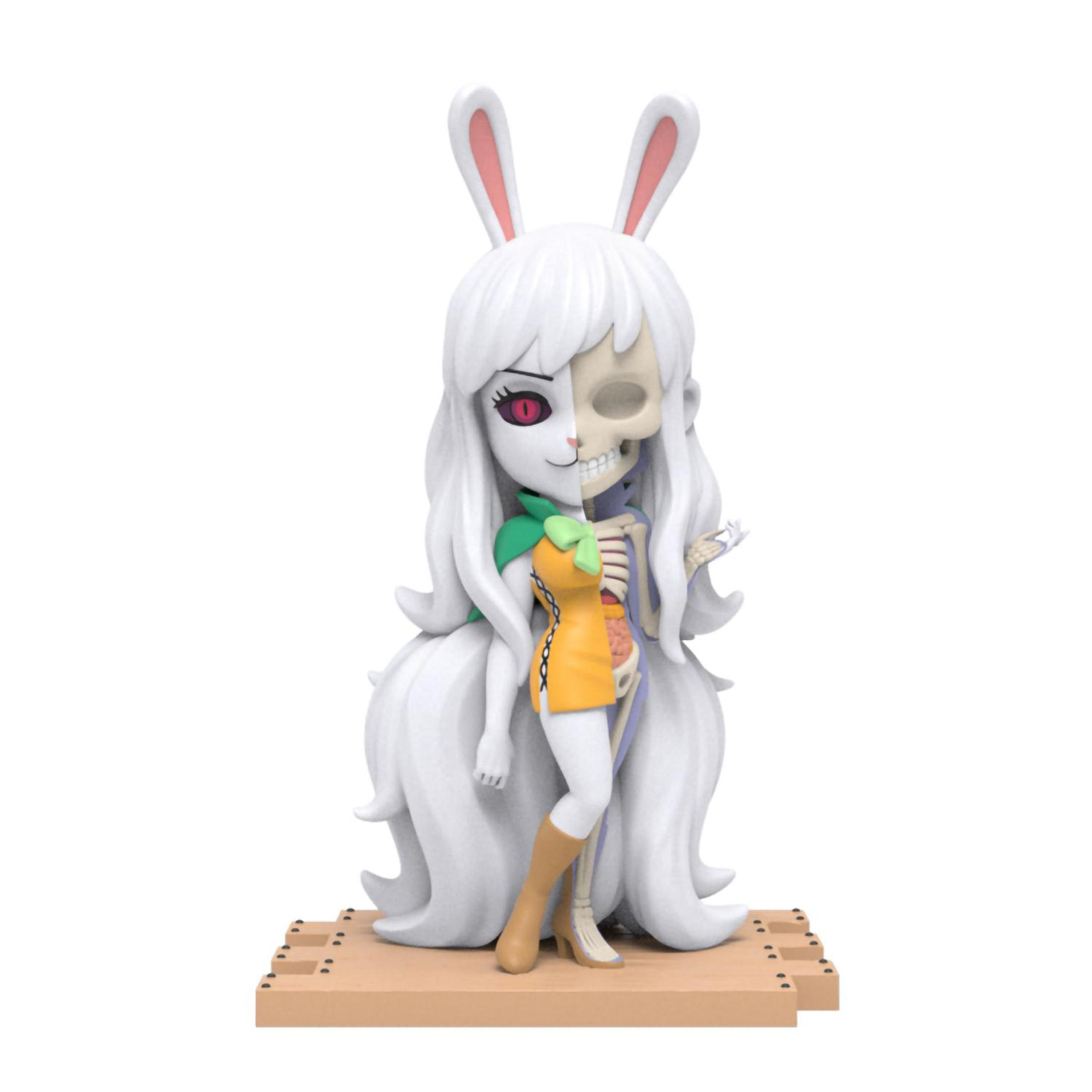 Figurka anime dziewczyny. Połowa normalna, połowa szkielet. Królicze uszy i sukienka. Białe tło.