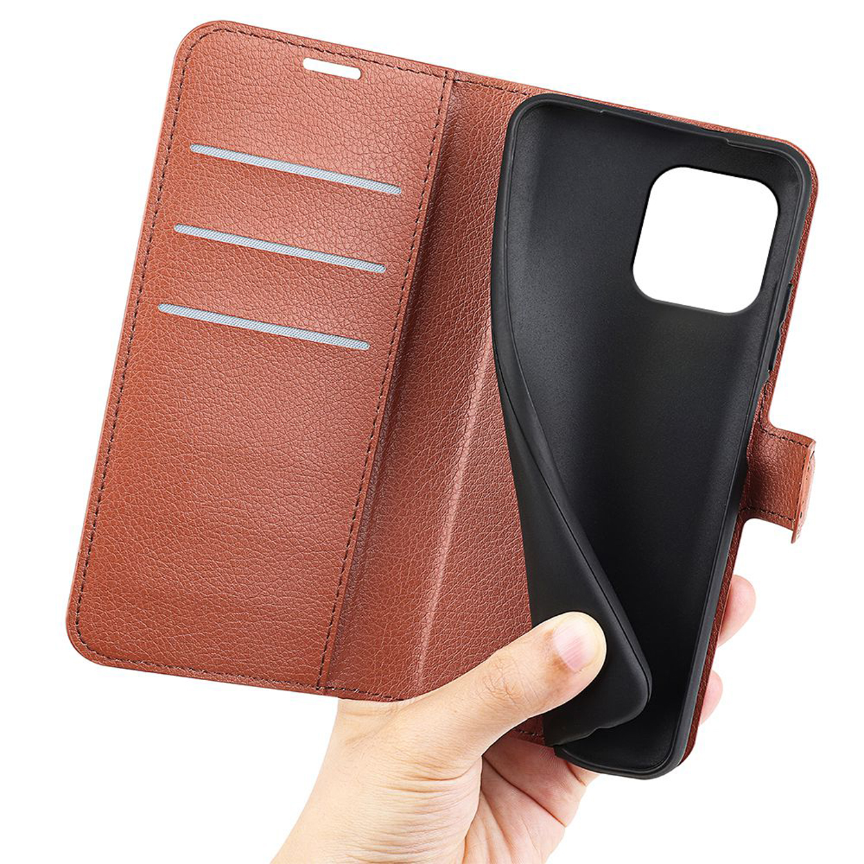 Brown phone case, open, with phone inside, held by a hand.