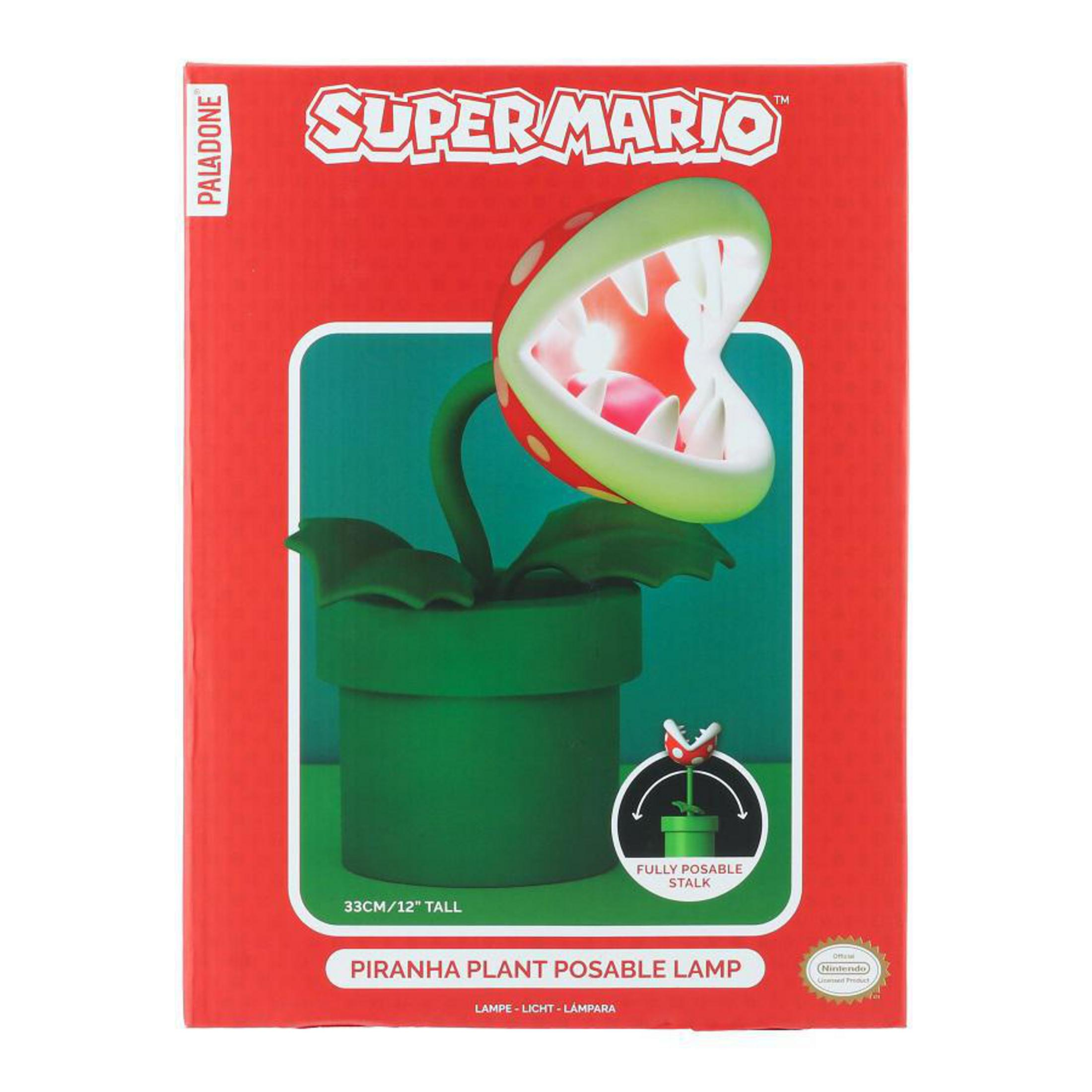 Pudełko lampy Super Mario Piranha Plant. Lampa w zielonej doniczce z czerwono-białymi ustami.
