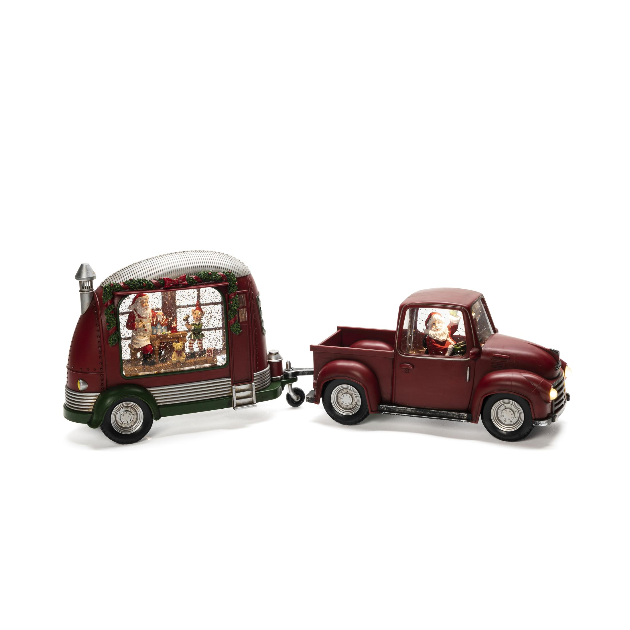 Weihnachtsszene mit rotem LKW und Anhänger. Der Weihnachtsmann ist in beiden. Schneekugeleffekt.