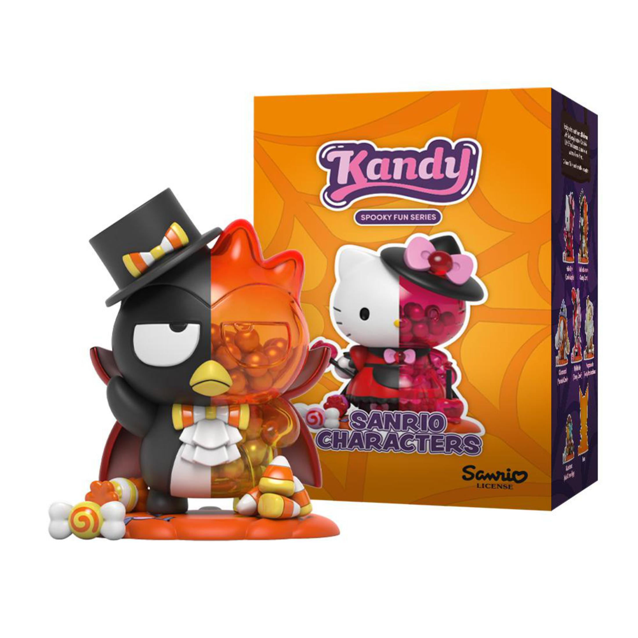 Une figurine Sanrio sur le thème d'Halloween avec un design Badtz-Maru et Hello Kitty, et une boîte colorée.