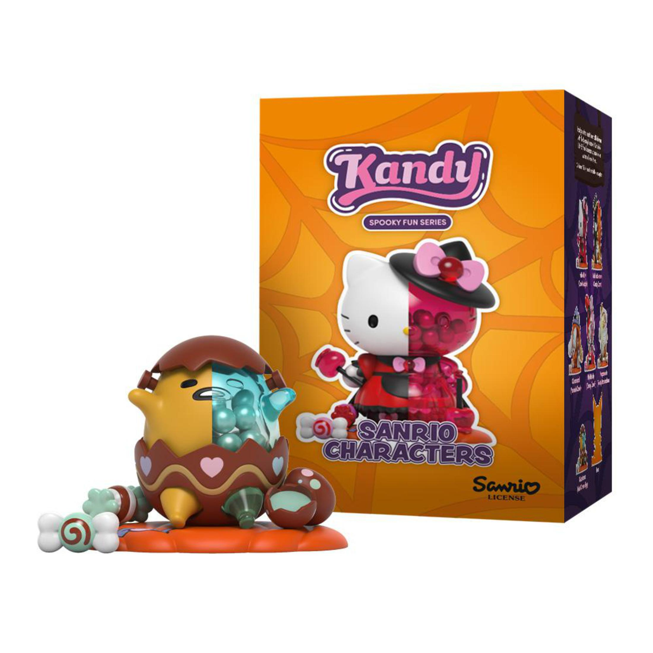Figurine Hello Kitty à deux faces à côté d'une boîte Kandy, personnages Sanrio.