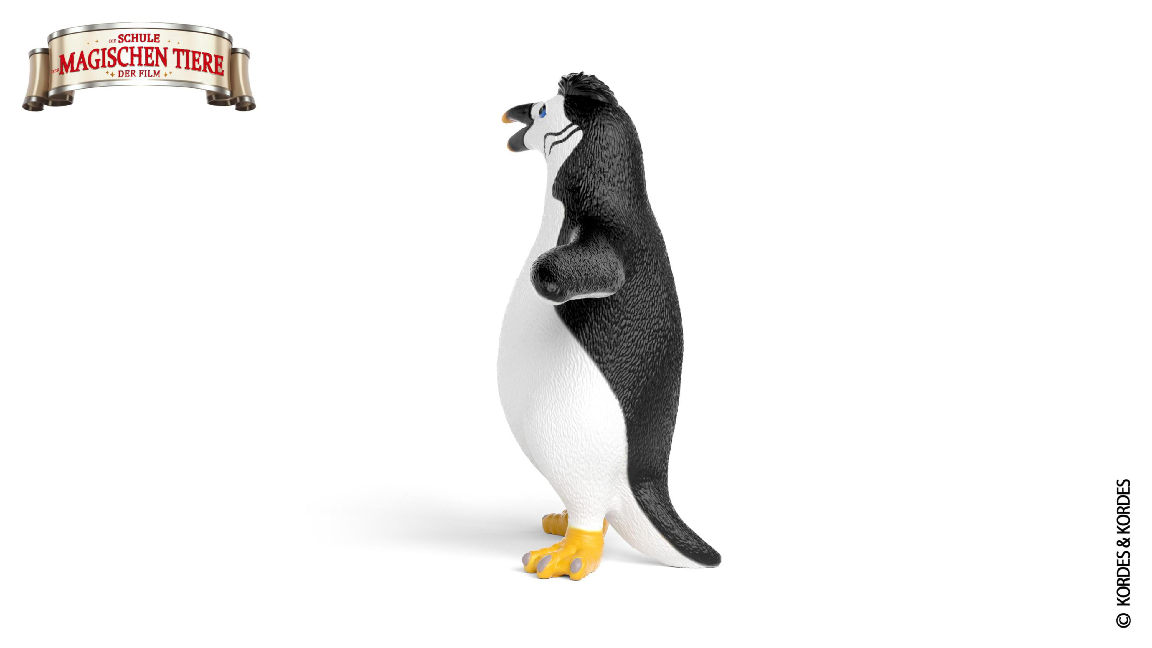 Figurka pingwina. Ma czarno-białe kolory, stoi na białej powierzchni.