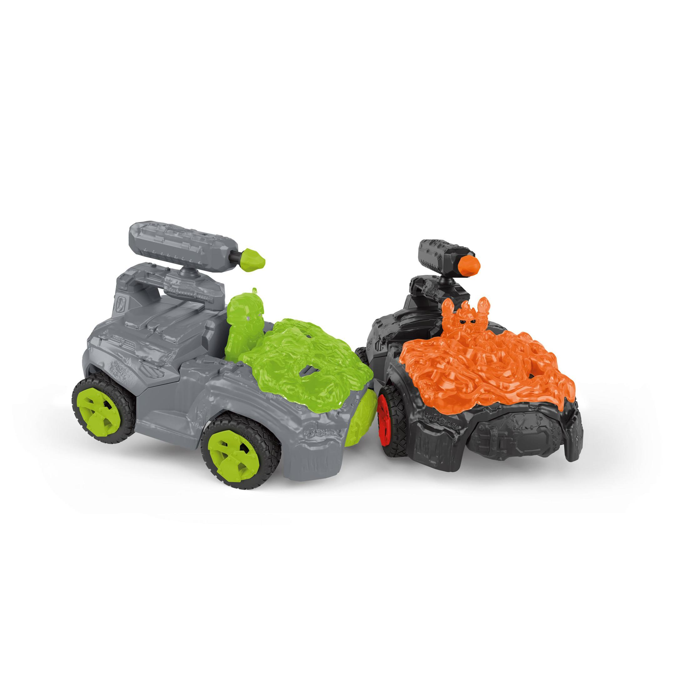 Zwei Spielzeugautos mit grünem und orangenem Schleim auf weißer Oberfläche.