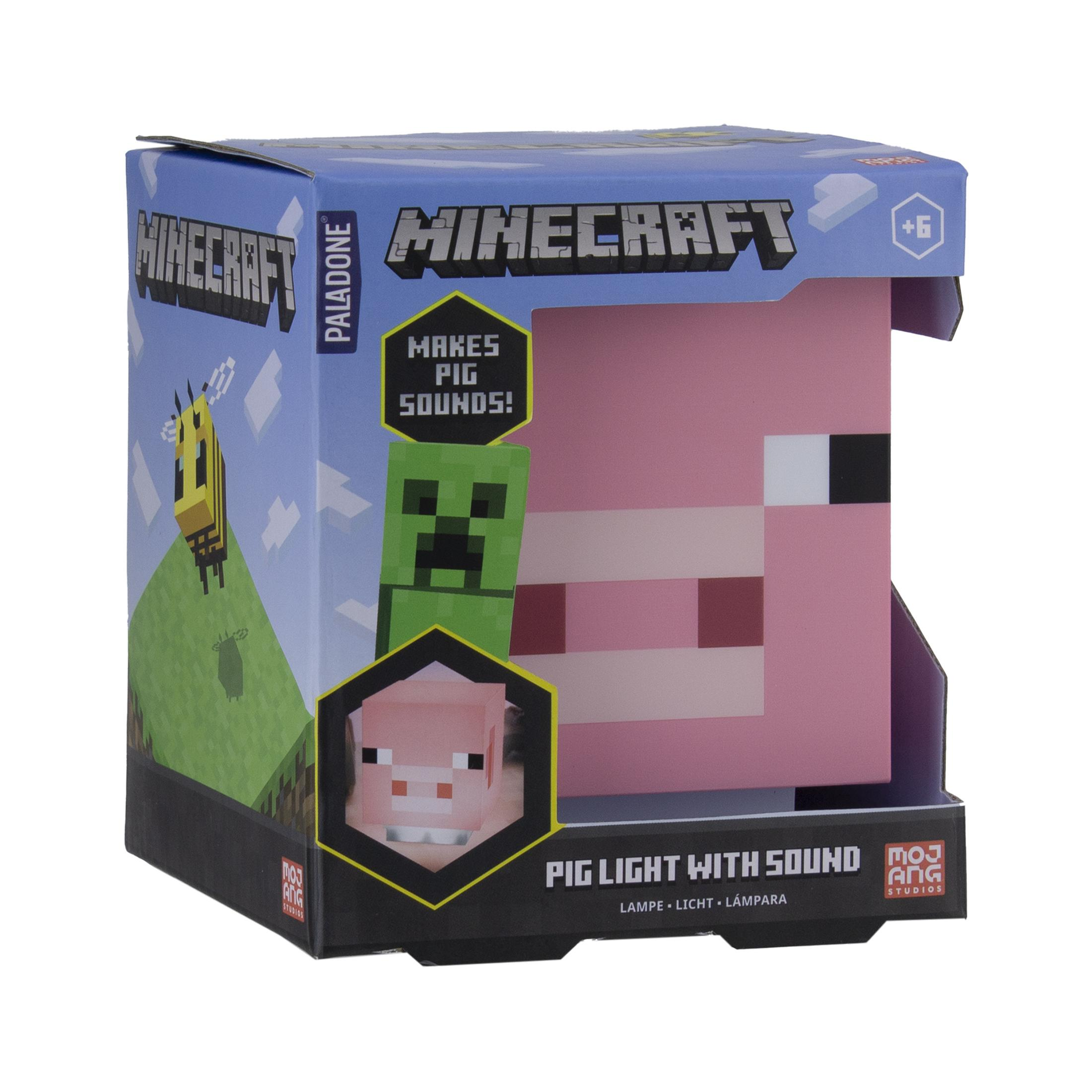 Eine Minecraft Pig Light Box, die einen Schweinekopf zeigt. Auf der Box sind ein Creeper und eine Biene.