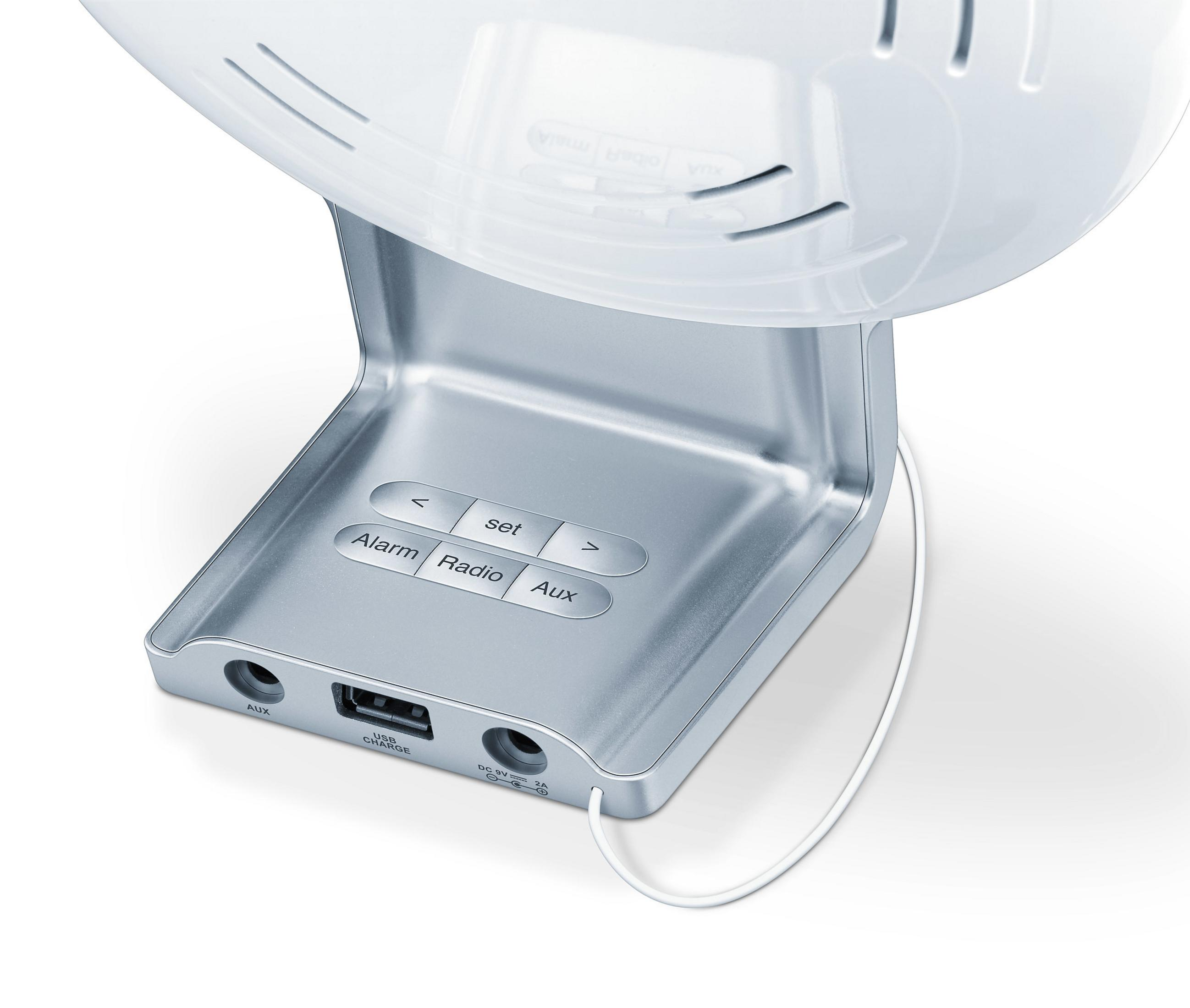 Base de despertador con botones y puerto USB, con una cúpula blanca encima.
