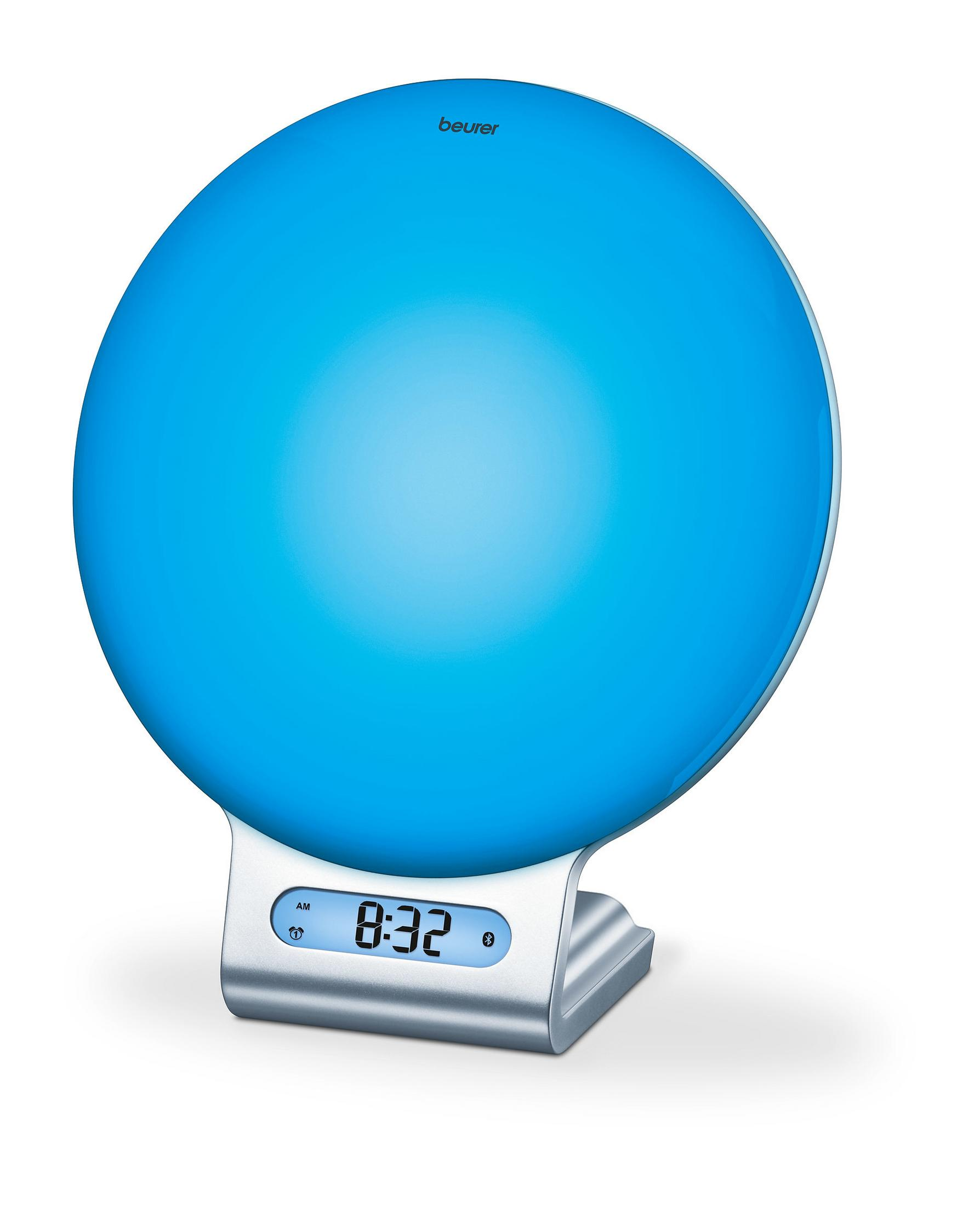 Una lámpara de terapia de luz azul sobre un soporte plateado, mostrando la hora como 8:32. Fondo blanco.