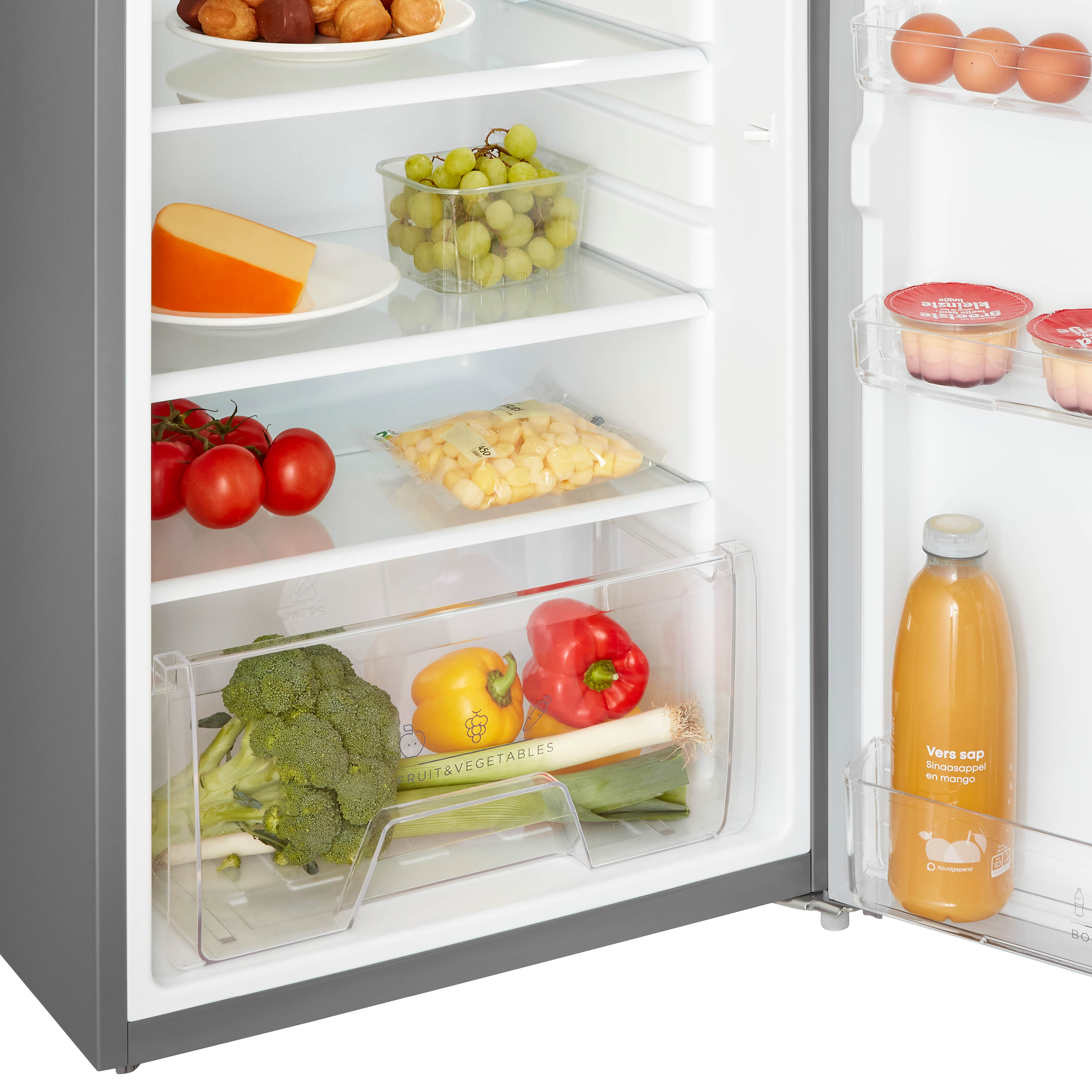 Refrigerator interior. Shelves hold food items like cheese, grapes, tomatoes, and bottled juice.